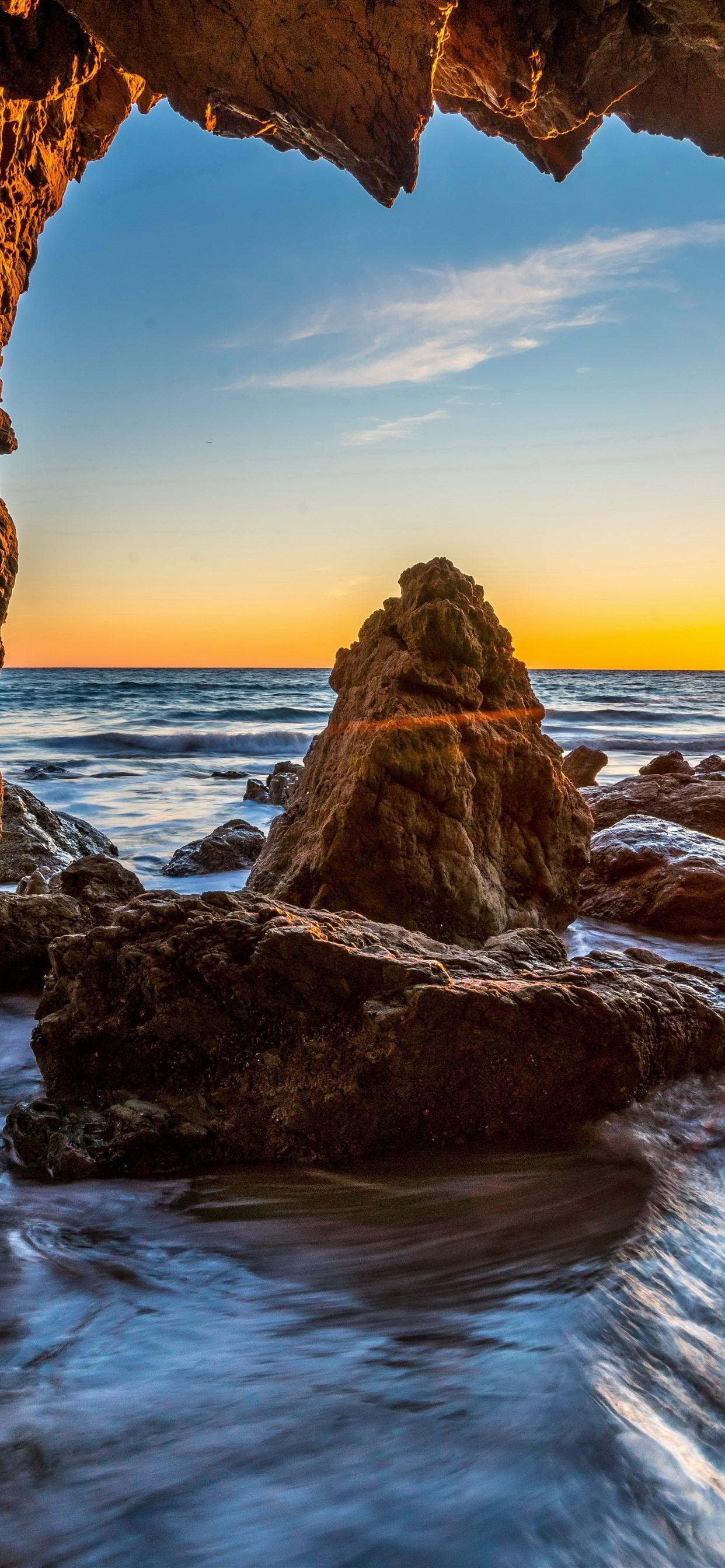 USA, Malibu, rocks, sea, cave, sunshine 1242x2688 iPhone XS Max