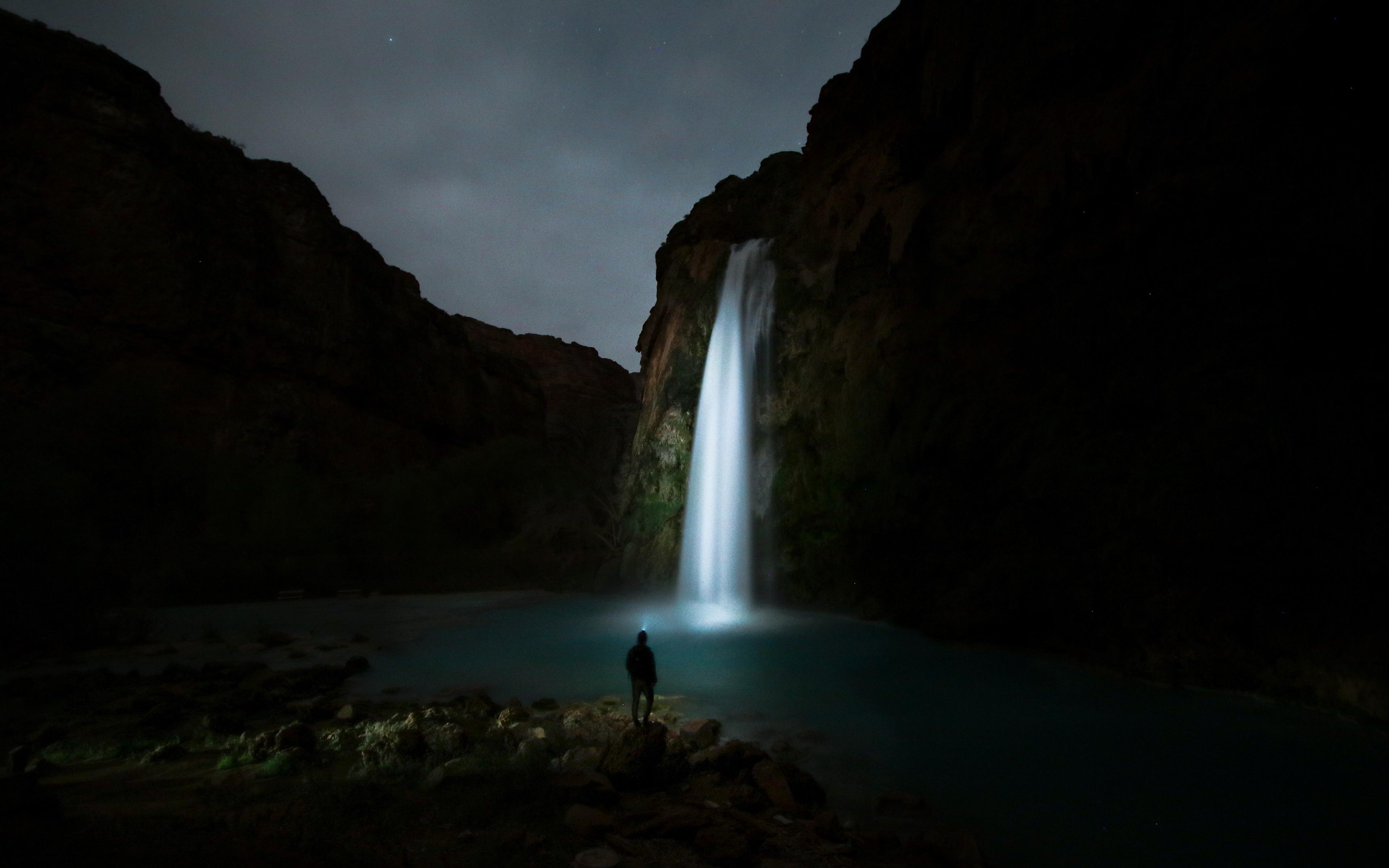 Download wallpaper 3840x2400 waterfall, night, man, river 4k ultra