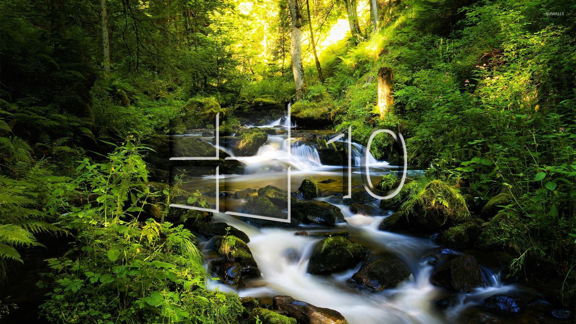 Windows 10 over the forest creek glass logo wallpaper