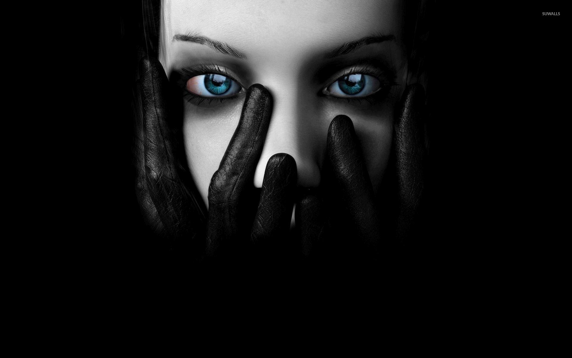 Girl with black leather gloves with hands on her face wallpaper