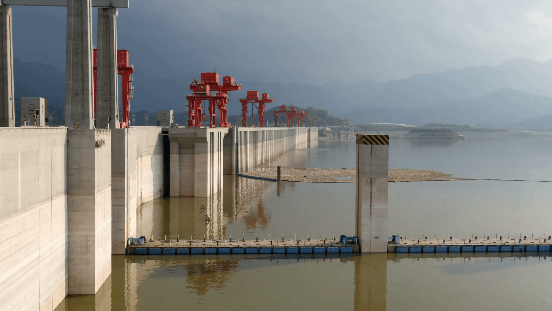 Three gorges dam, Yichang, China angle view from side with red crane towe Stock Video Footage