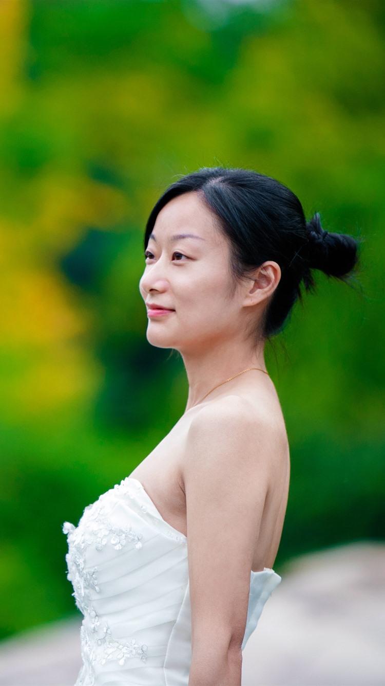 Asian girl, bride, side view, green background 1080x1920