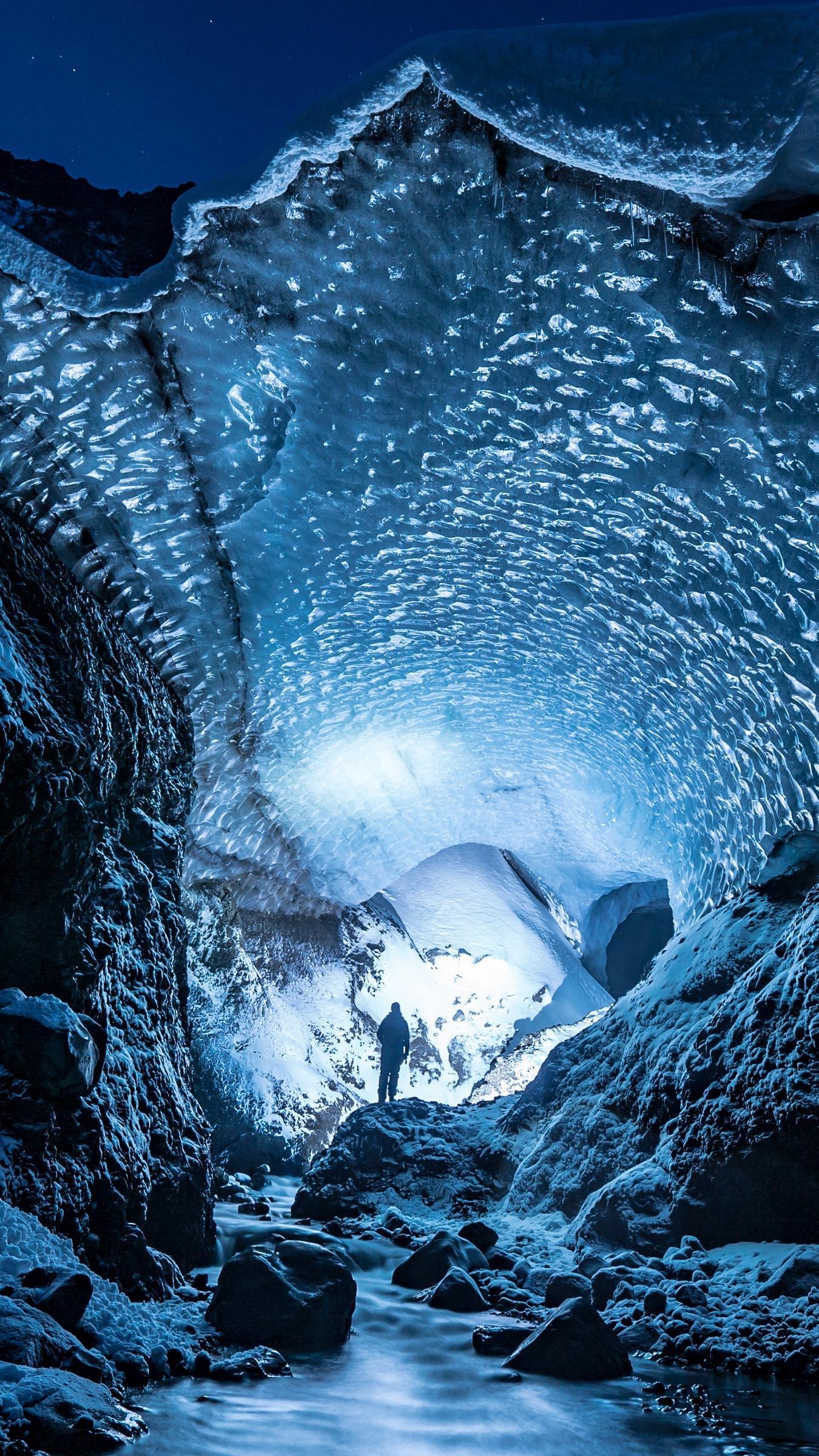 Download wallpaper 1350x2400 glacier, cave, man, ice, snow