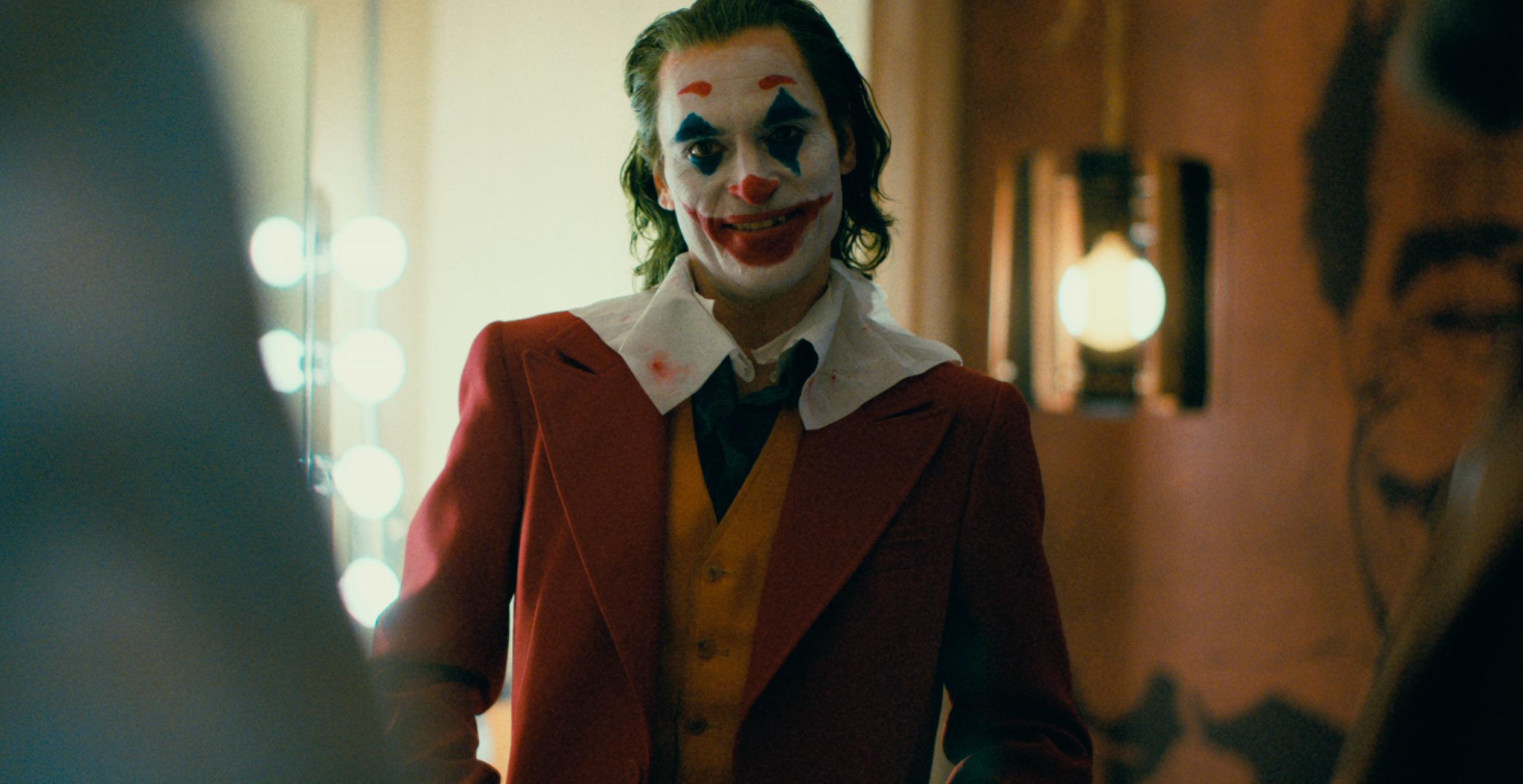 Joaquin Phoenix Dances and Smiles in New Joker Posters