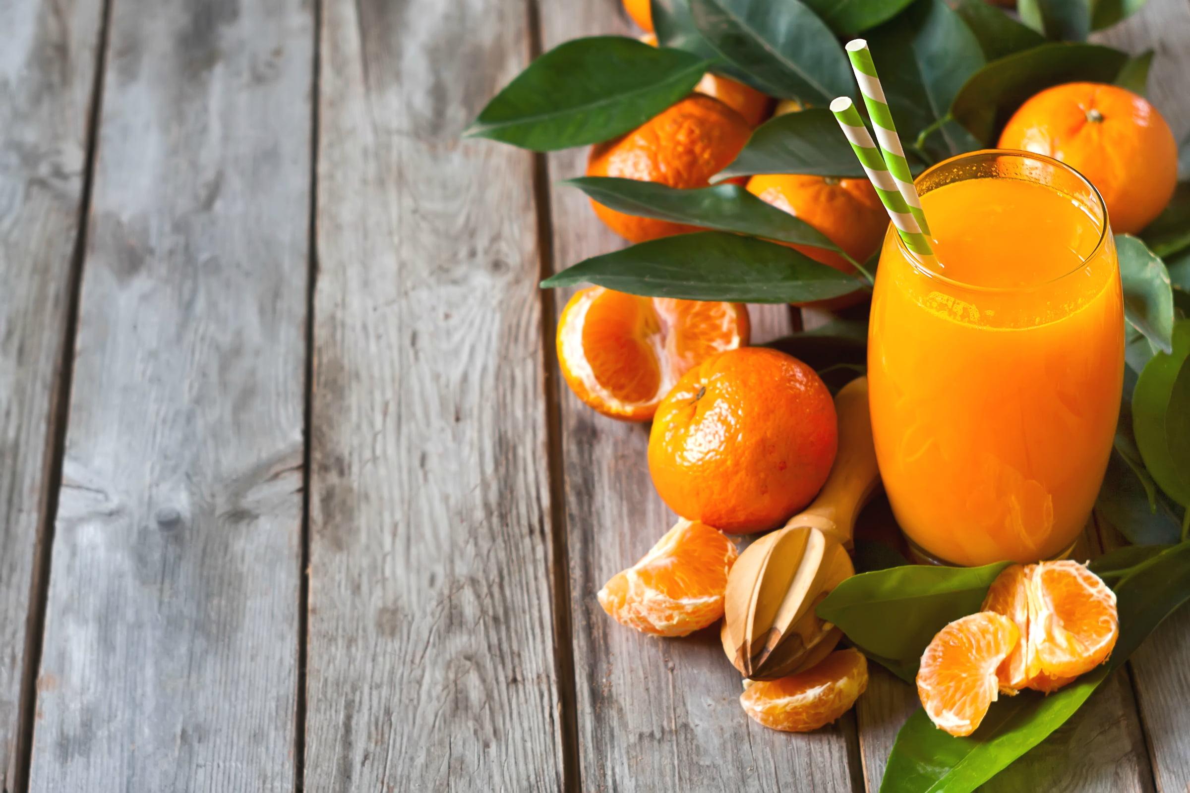 Sliced orange fruit with orange juice HD wallpaper