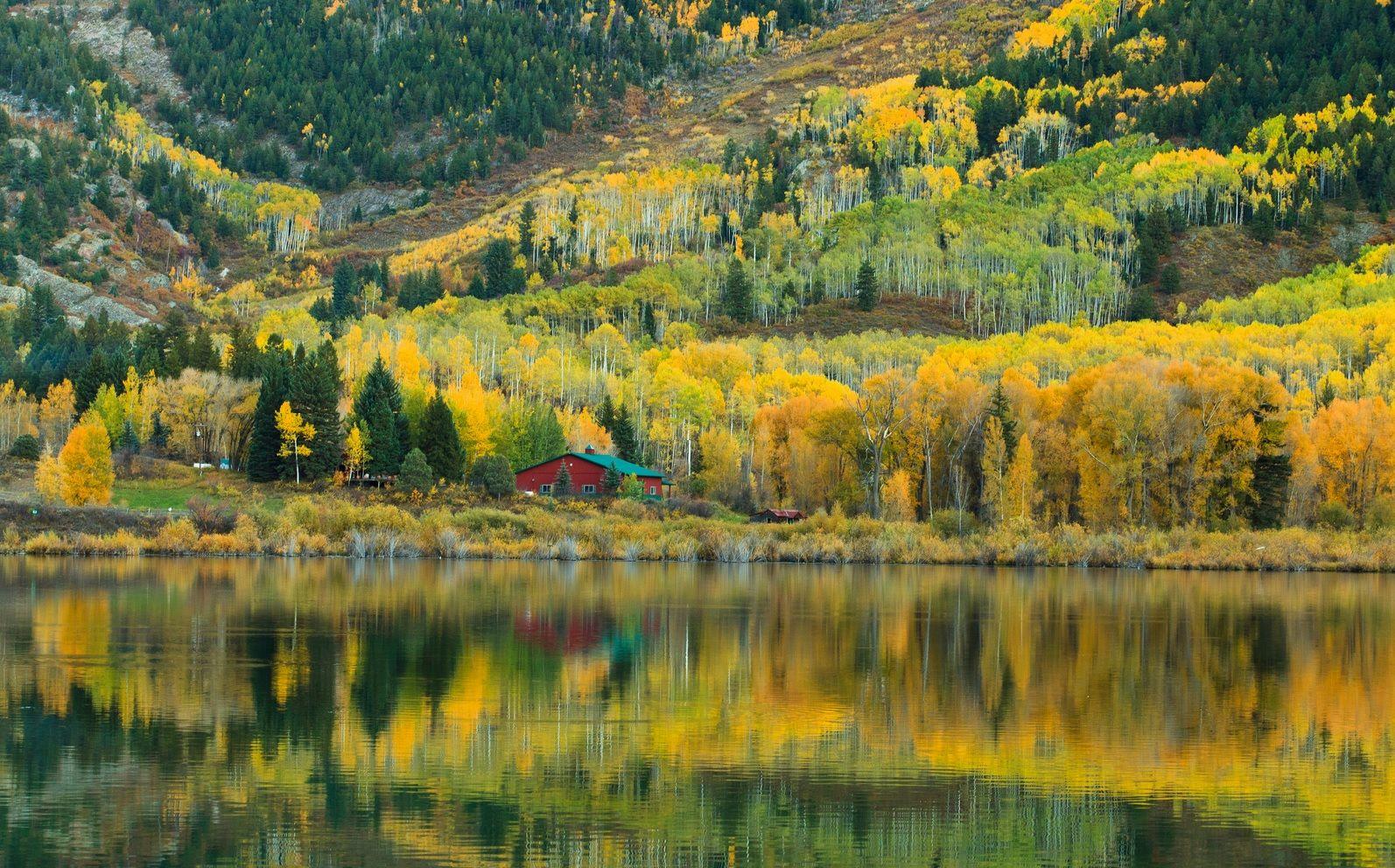 Golden autumn reflections at a Rocky Mountain farmstead
