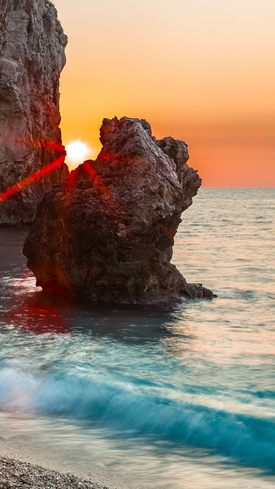 Sun Behind Rocks Clear Blue Sea iPhone 6 Plus HD Wallpaper