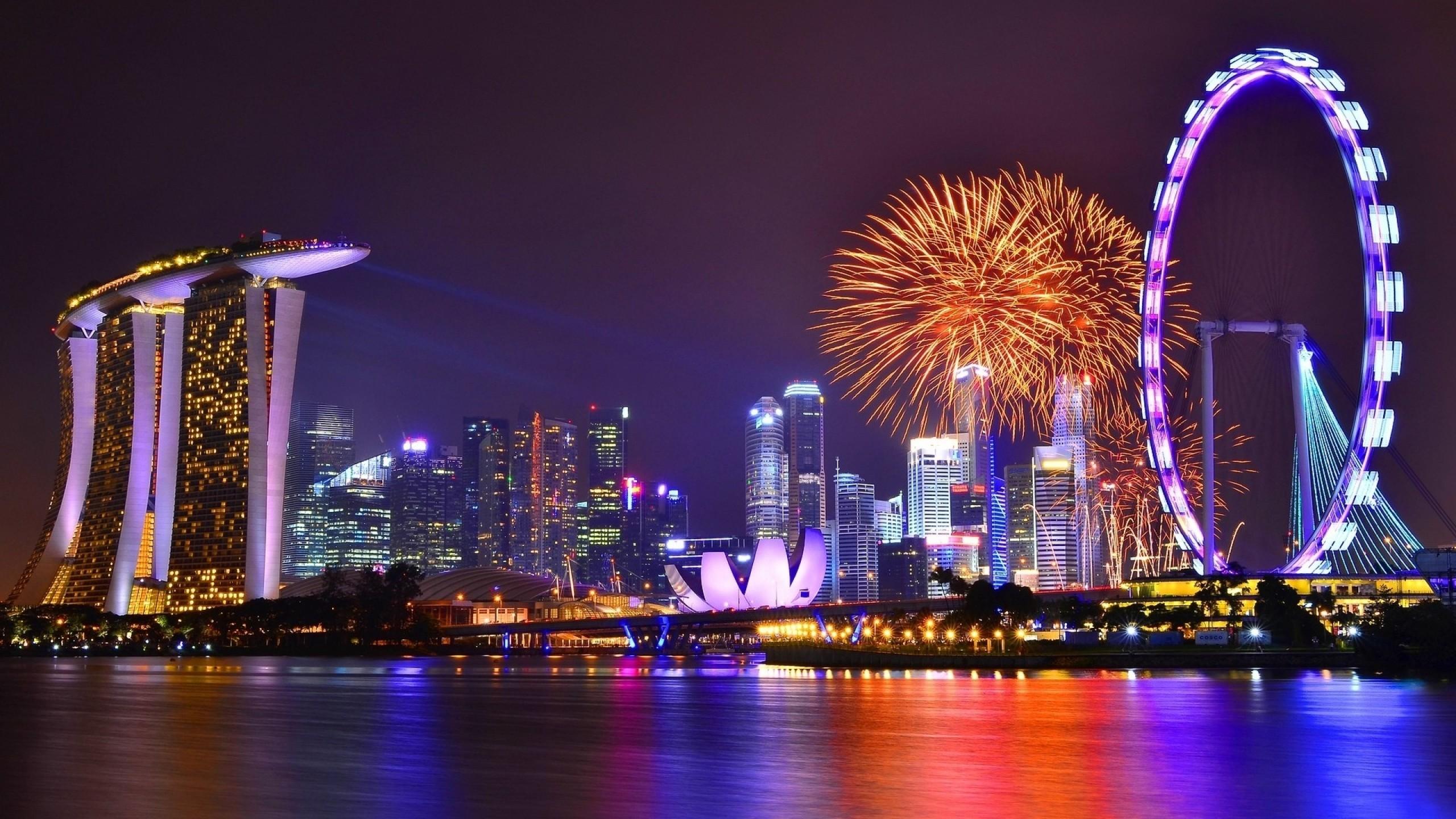 Download 2560x1440 Singapore, Skyscrapers, Ferris Wheel