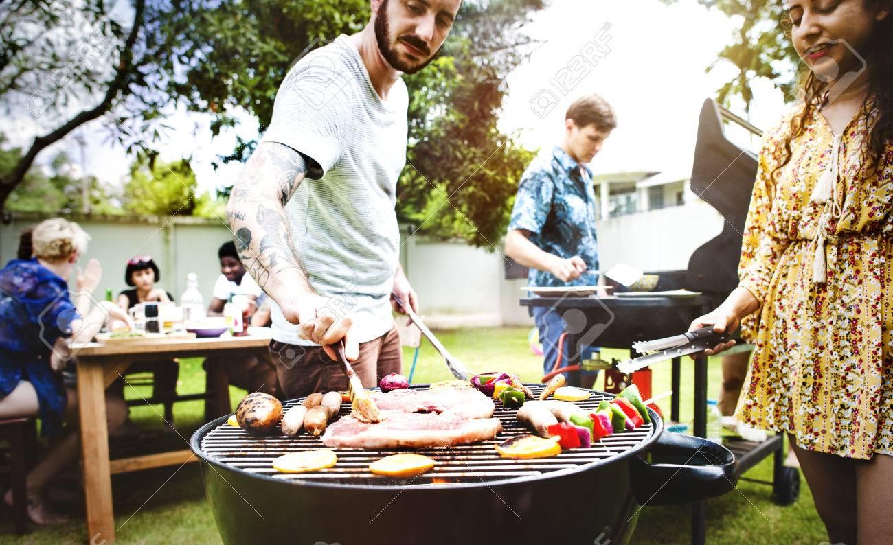 Best Group of diverse friends grilling barbecue outdoors