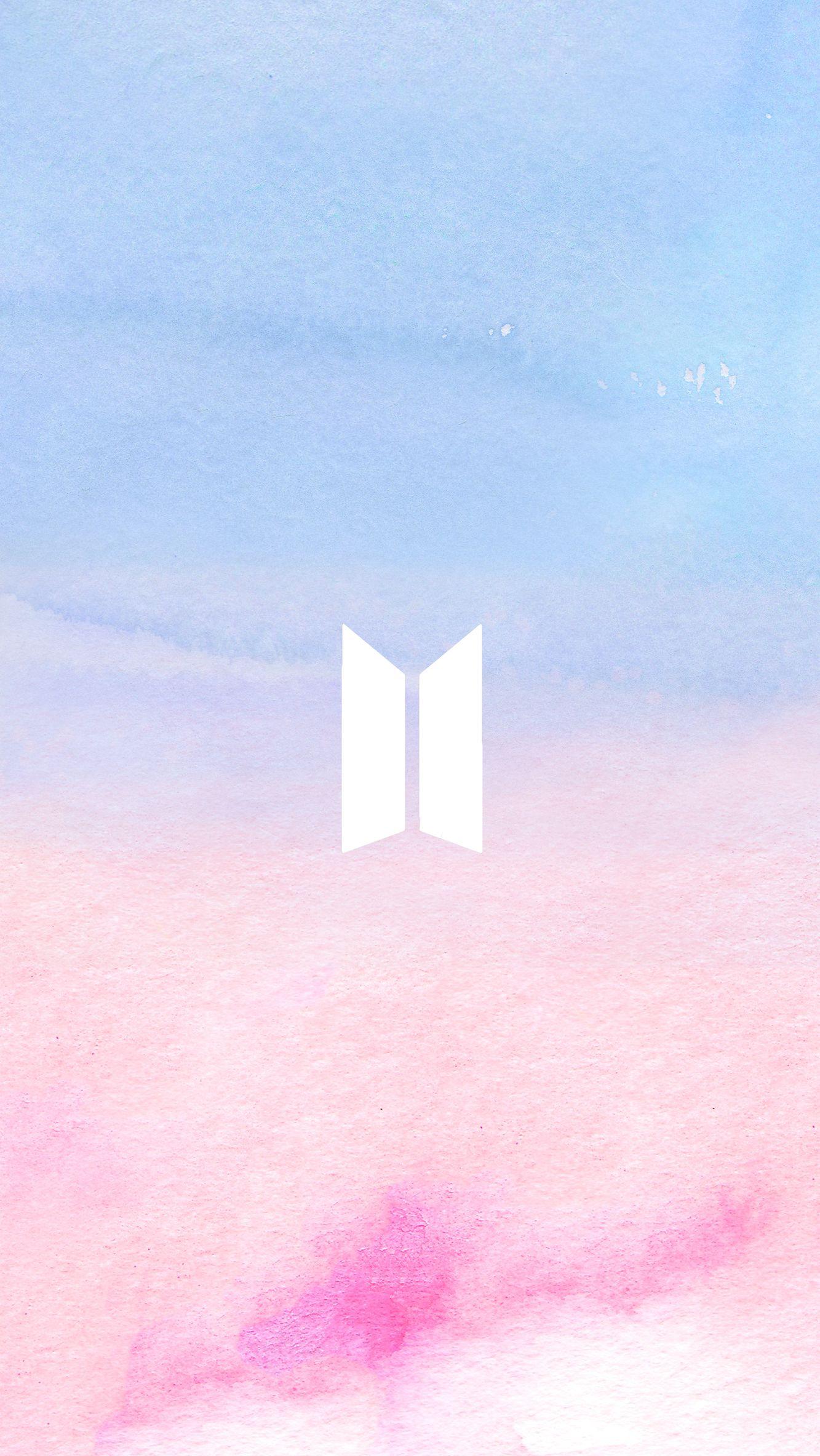 BTS's symbol over a pink and blue watercolor background. K