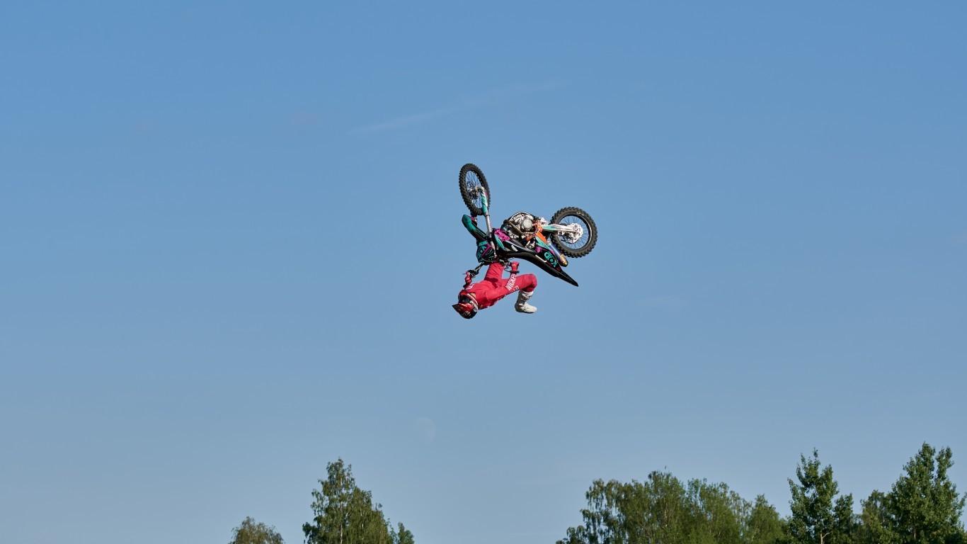 Download 1366x768 Motorbike, Jumping, Clear Sky, Freestyle