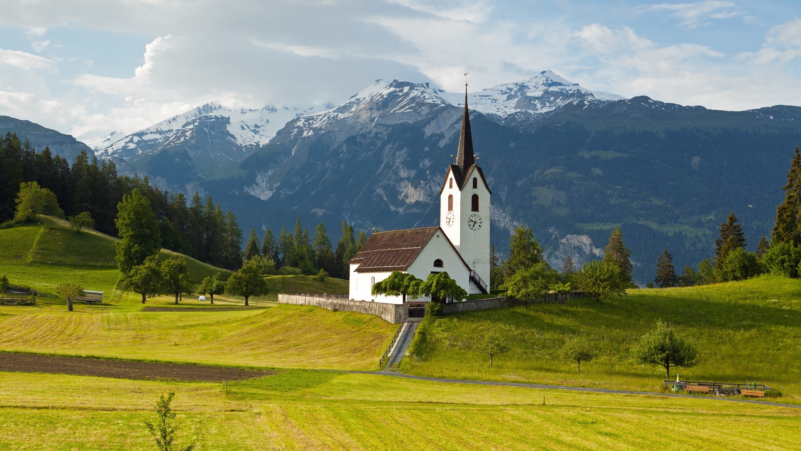 Download 2560x1440 Switzerland, Church, Field, Mountains