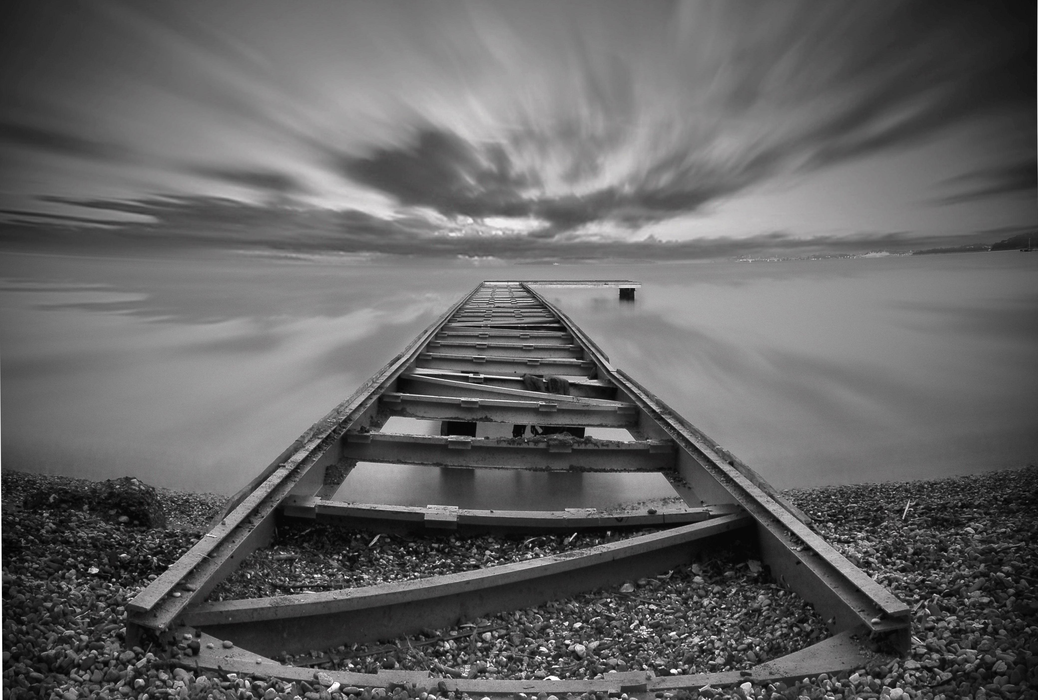 Grayscale photography of fishing dock HD wallpaper