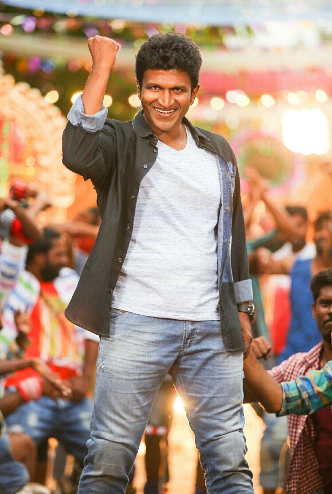 Actor Puneeth Rajkumar Is Wearing White Shirt Standing In Blur Background  HD Puneeth Rajkumar Wallpapers | HD Wallpapers | ID #92042
