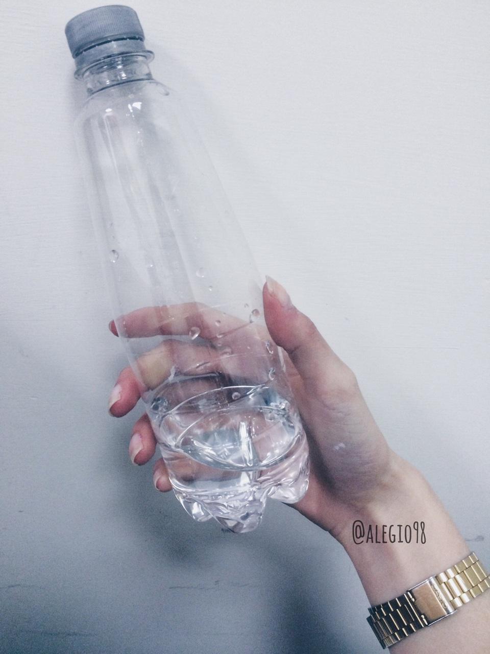 Follow me On Instagram Blue bottle of water in a