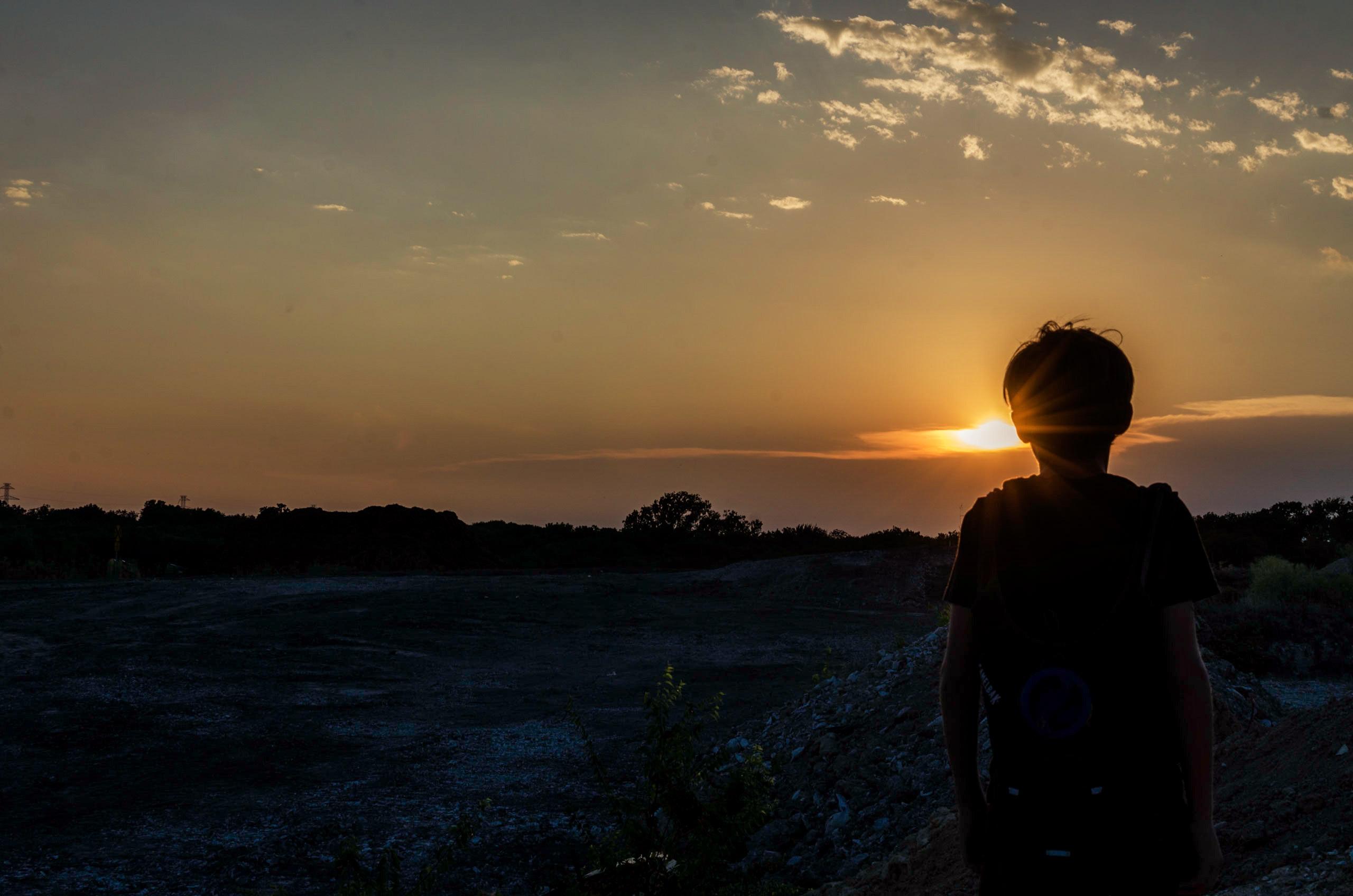 Silhouette of a Boy During Sunset · Free