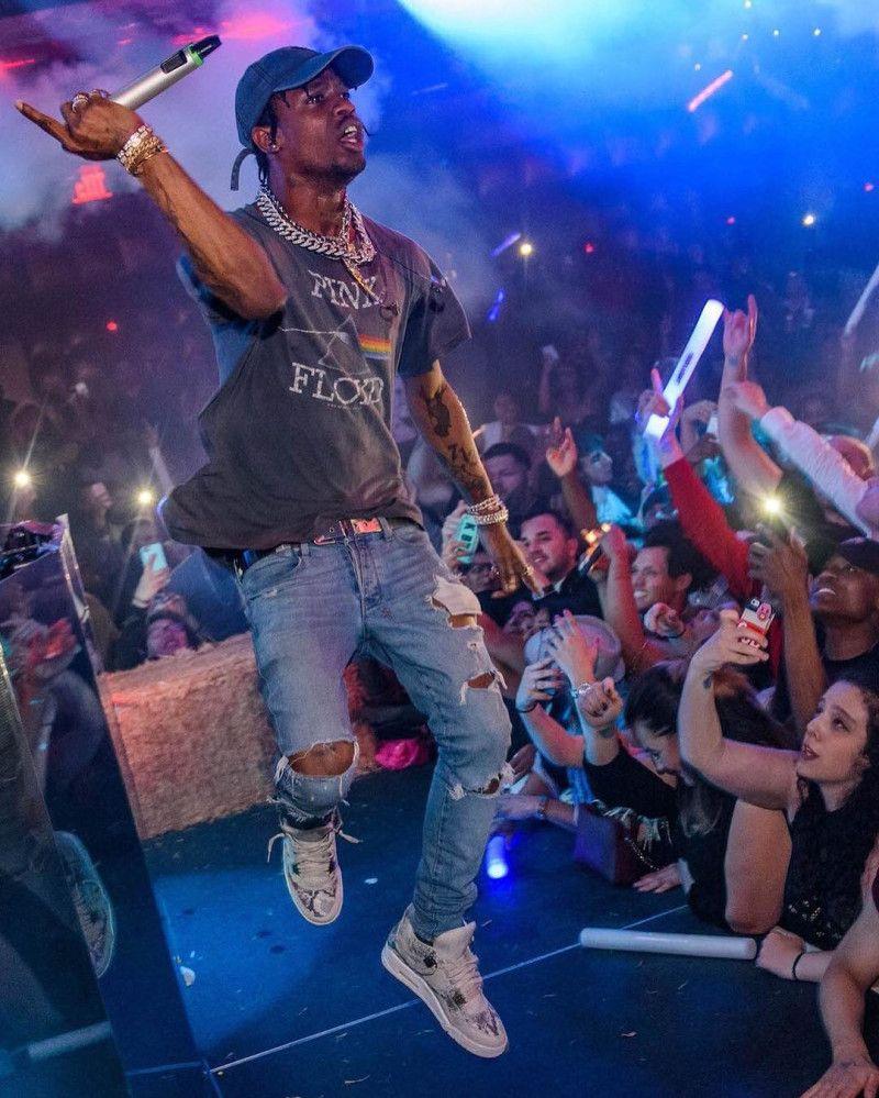 Travis Scott Wearing the Air Jordan 4 Premium Snakeskin