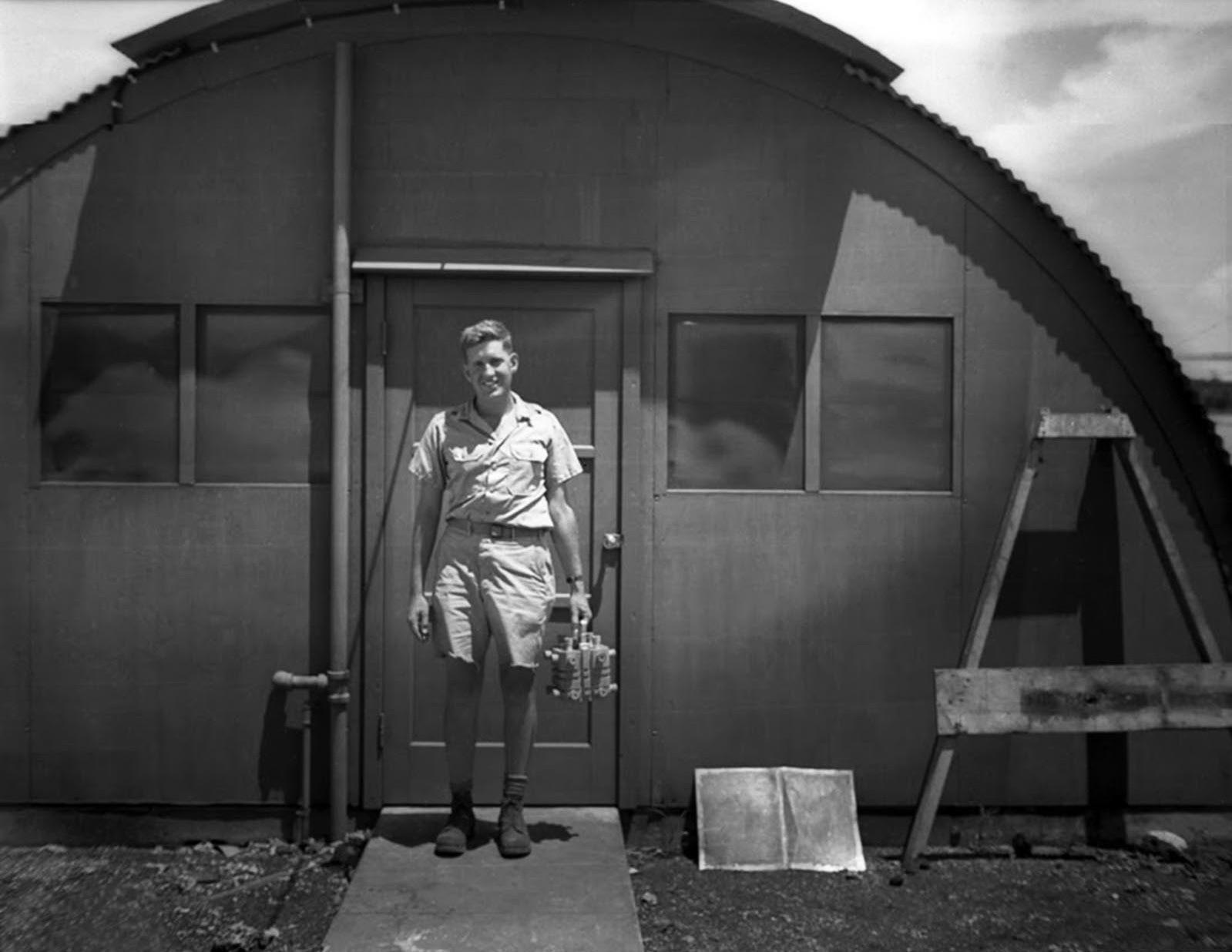 Harold Agnew carrying the plutonium core of the Nagasaki Fat