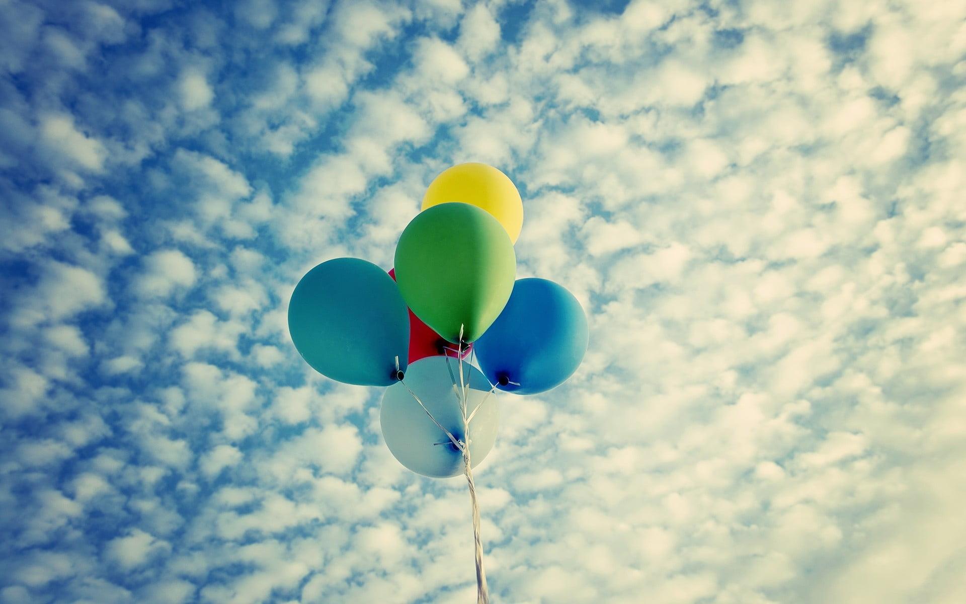 Assorted color balloon flying on cloudy sky HD wallpaper