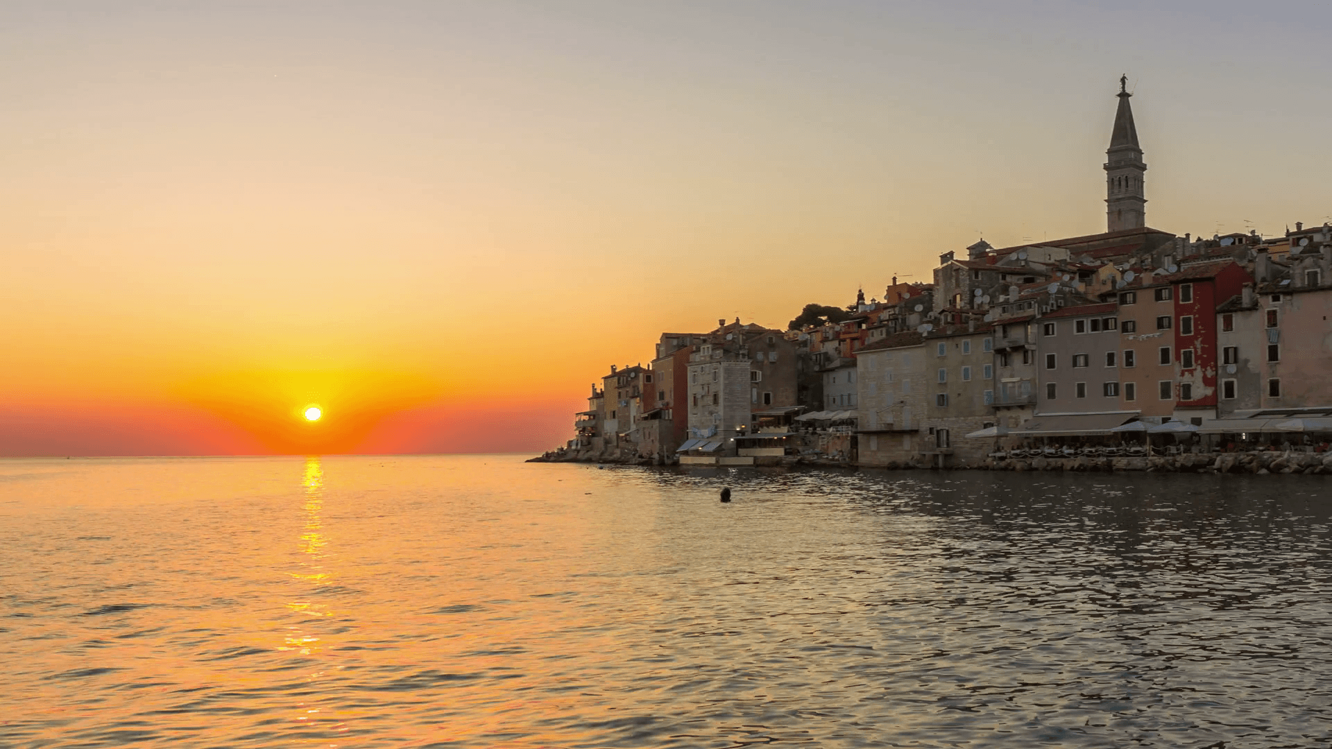 Sunset time lapse at Rovinj, Croatia view of old town of Rovinj in Istria, Croatia at beautiful colorful sunset sky. Rovinj is popular