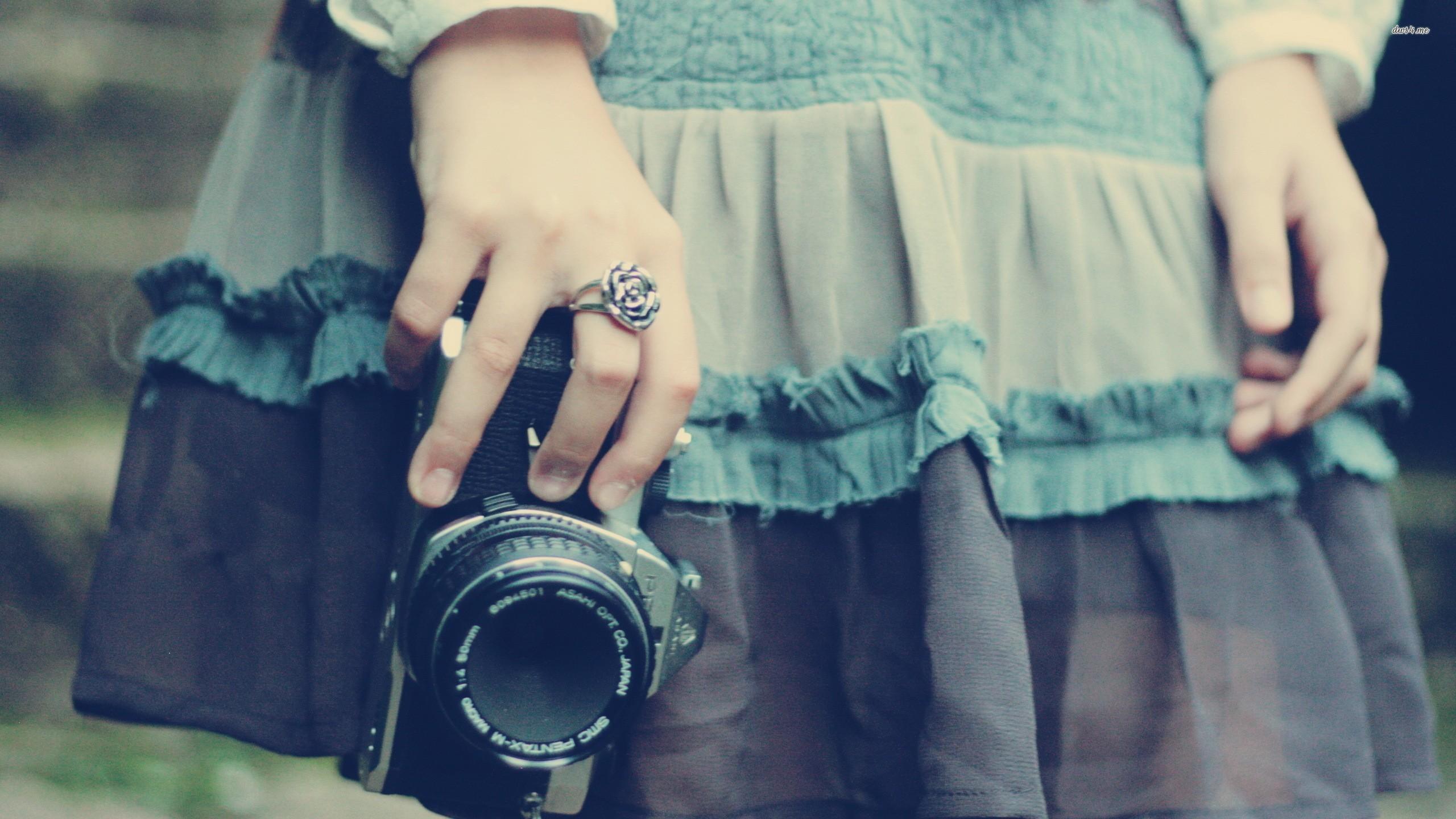 Girl holding a camera wallpaper wallpaper