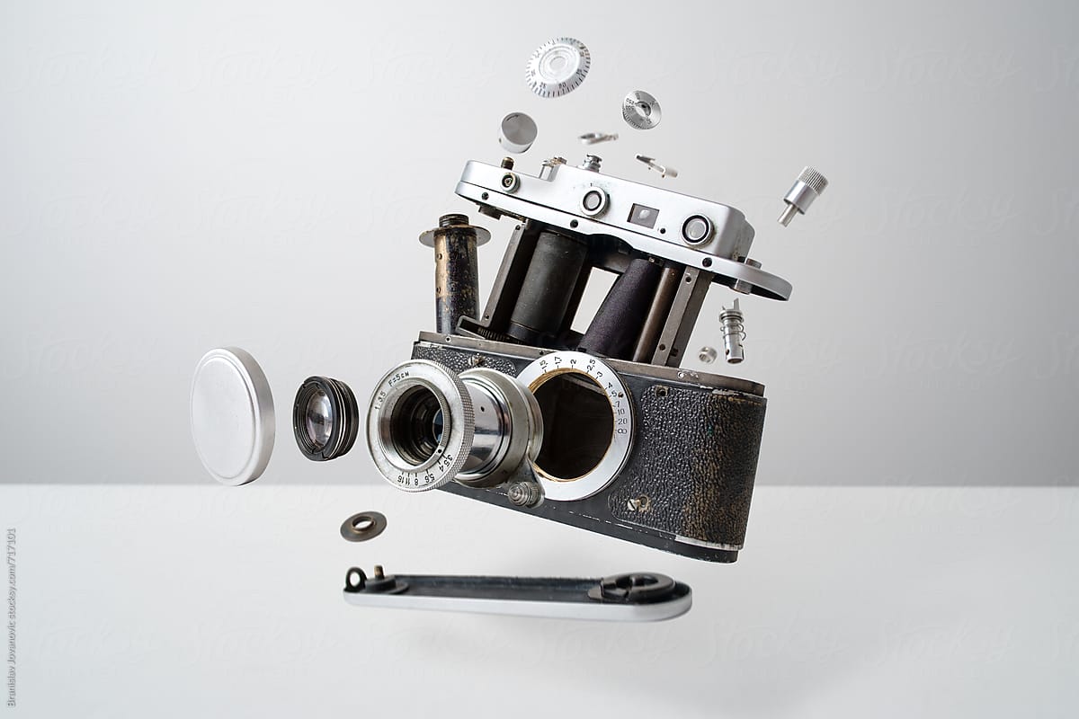 Disassembled Analog Camera On White Background