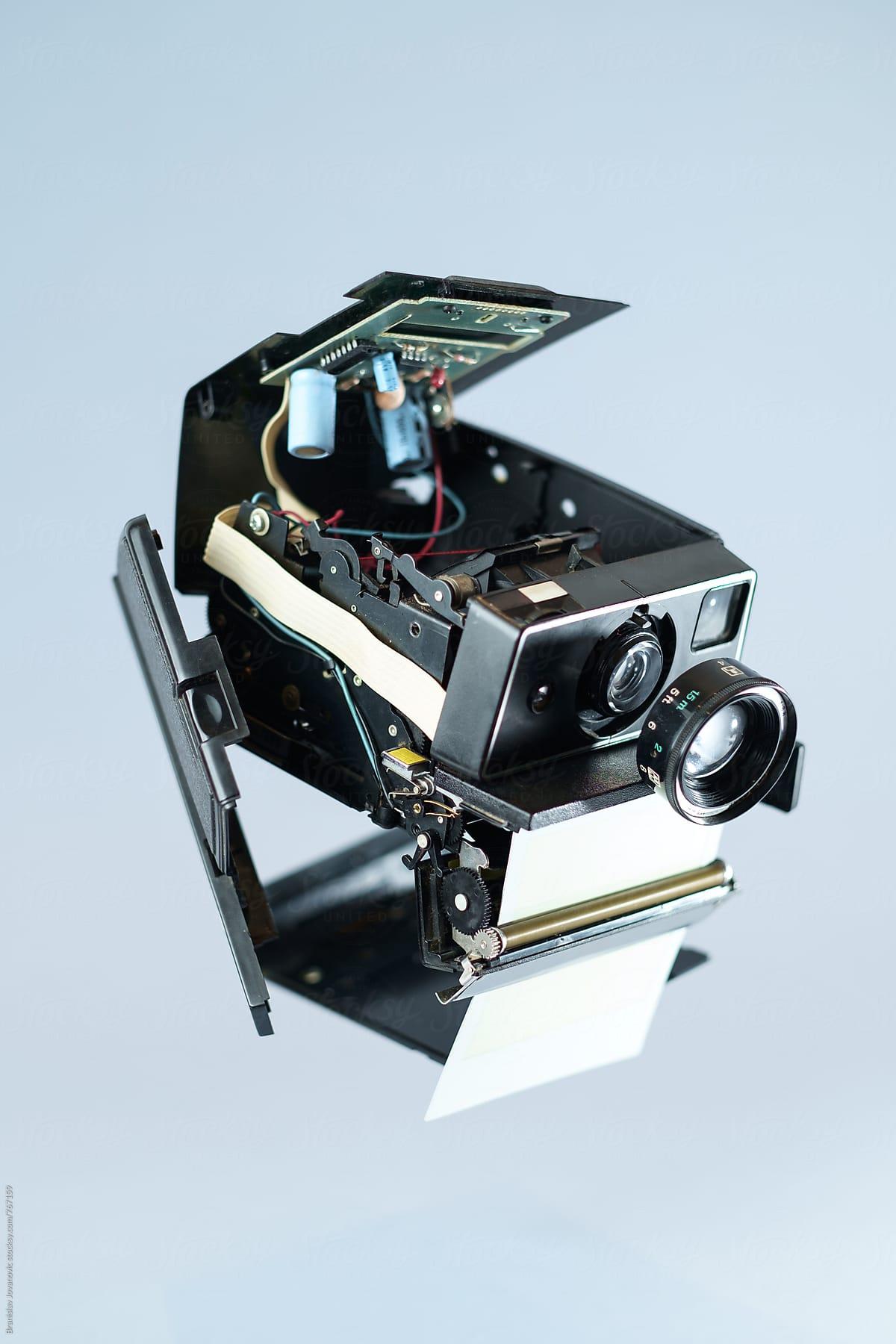 Disassembled Old Polaroid Camera Floating