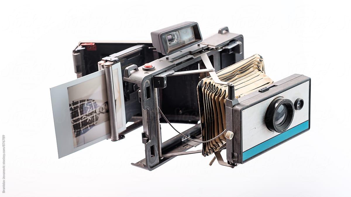 Disassembled Old Polaroid Camera On The White Background