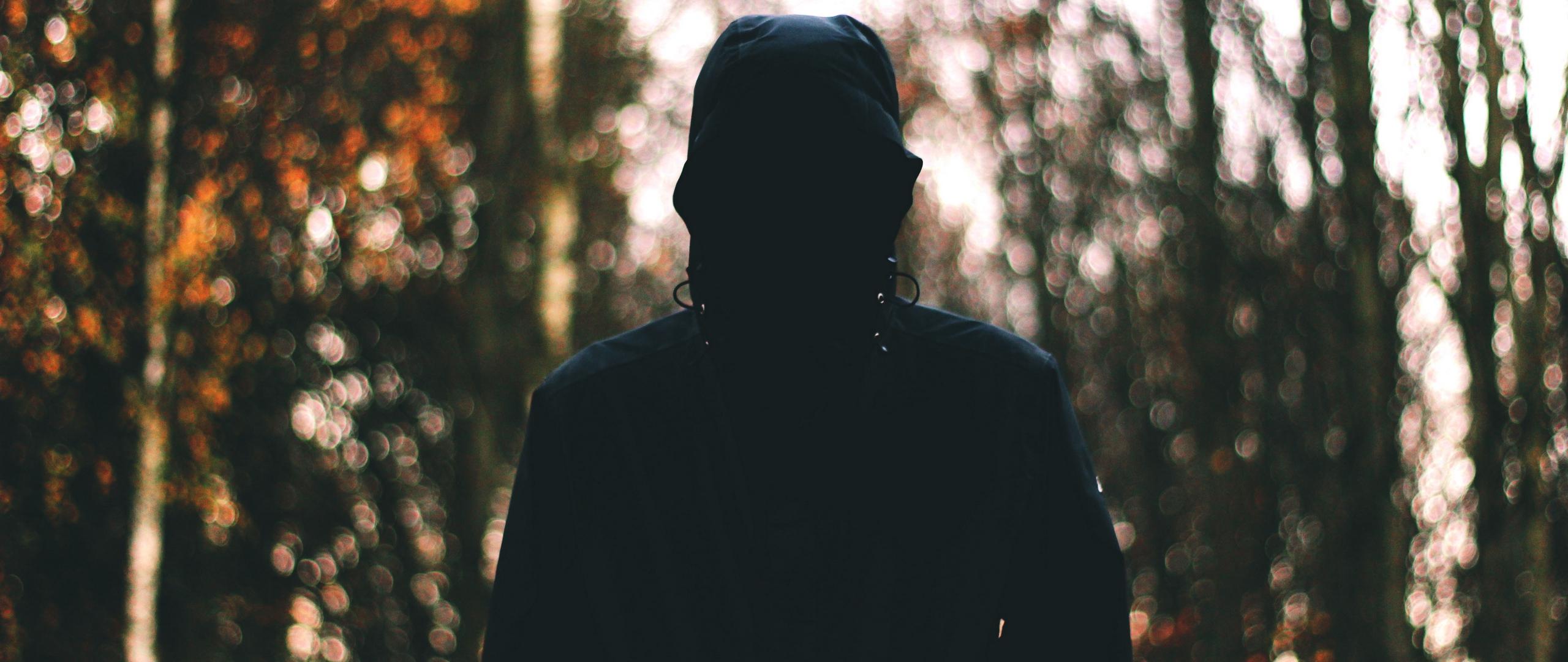 Download wallpaper 2560x1080 man, hood, anonymous, dark dual