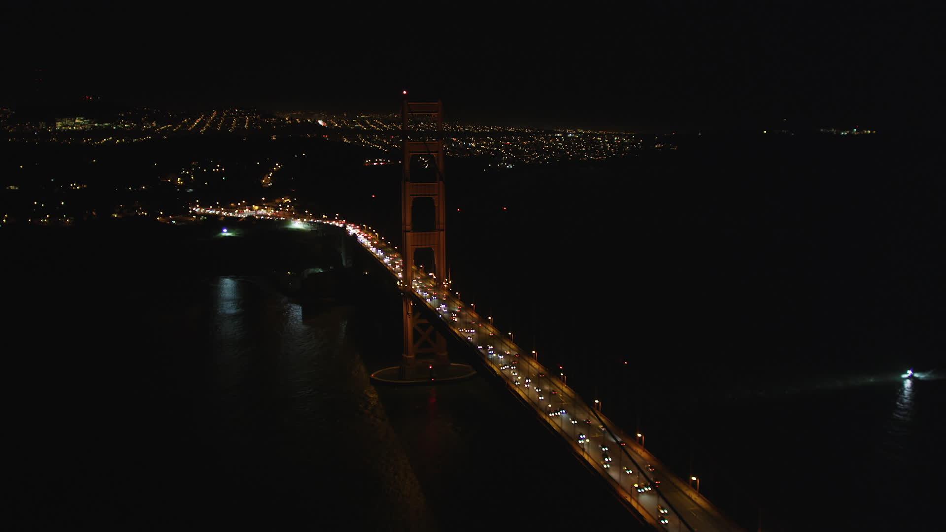 5K stock footage aerial video of approaching the iconic Golden Gate Bridge, San Francisco, California, night Aerial Stock Footage DFKSF07_041. Axiom
