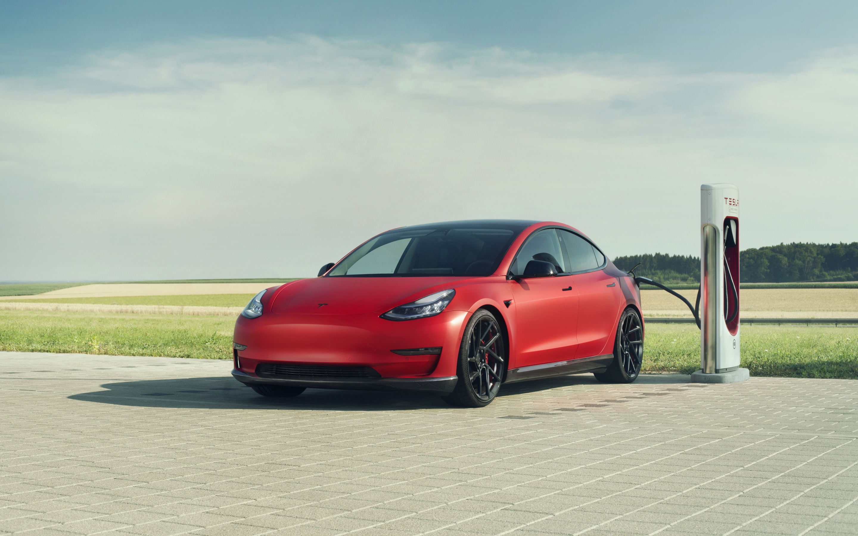 Download wallpaper Novitec, Tesla Model exterior, front view, red electric car, new red Model electric cars, Tesla, electric car charging for desktop with resolution 2880x1800. High Quality HD picture wallpaper