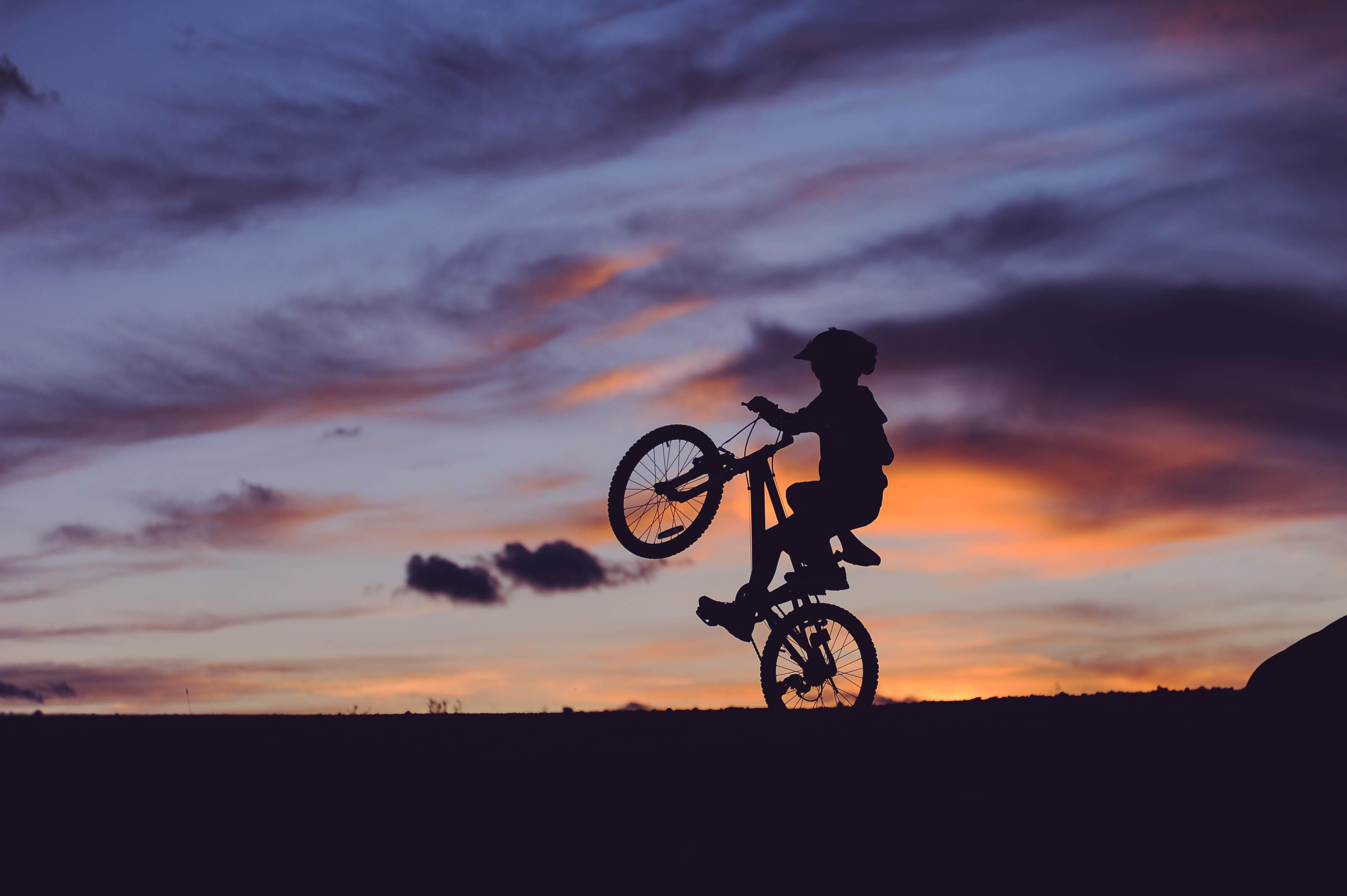 3857x2567 #wheelie, #sunset, #dusk, #boy, #purple, #mountain bike, # bicycle, #sunrise, #shadow, #bike ride, #ride, #evening, #kid, #orange, # bike, #silhouette, #Public domain image HD Wallpaper