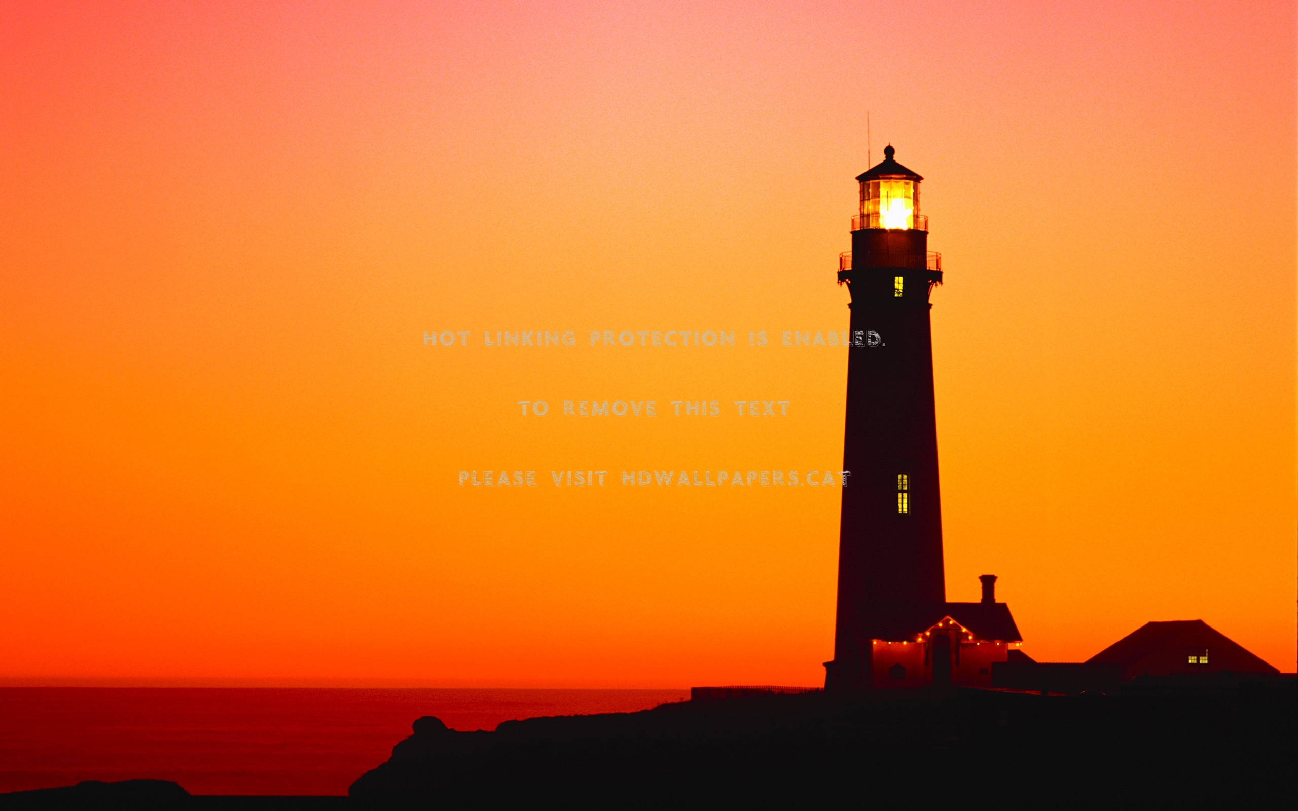 lighthouse at sunset ocean seascape