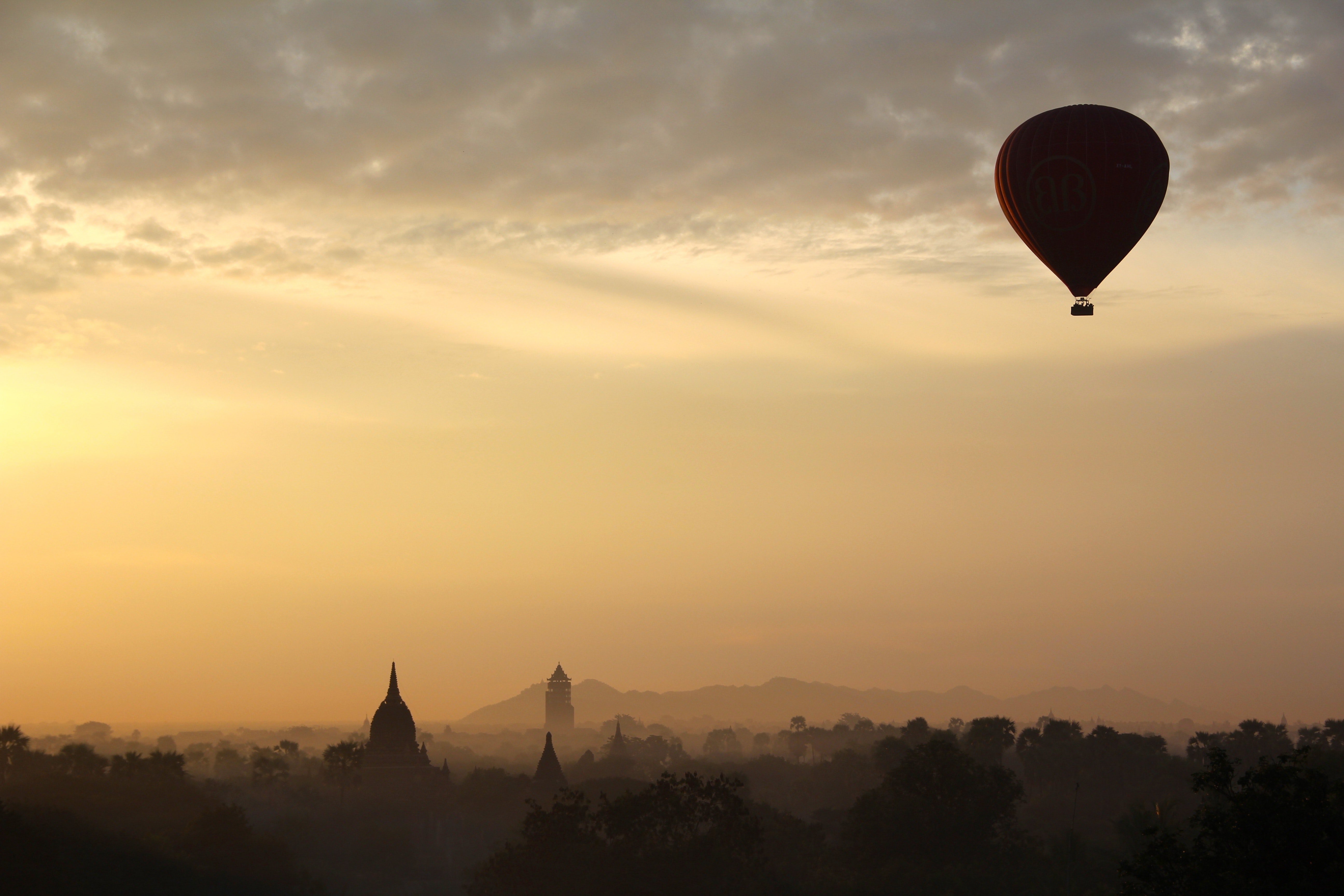 Hot Air Balloon and City Silhouette during Daytime · Free