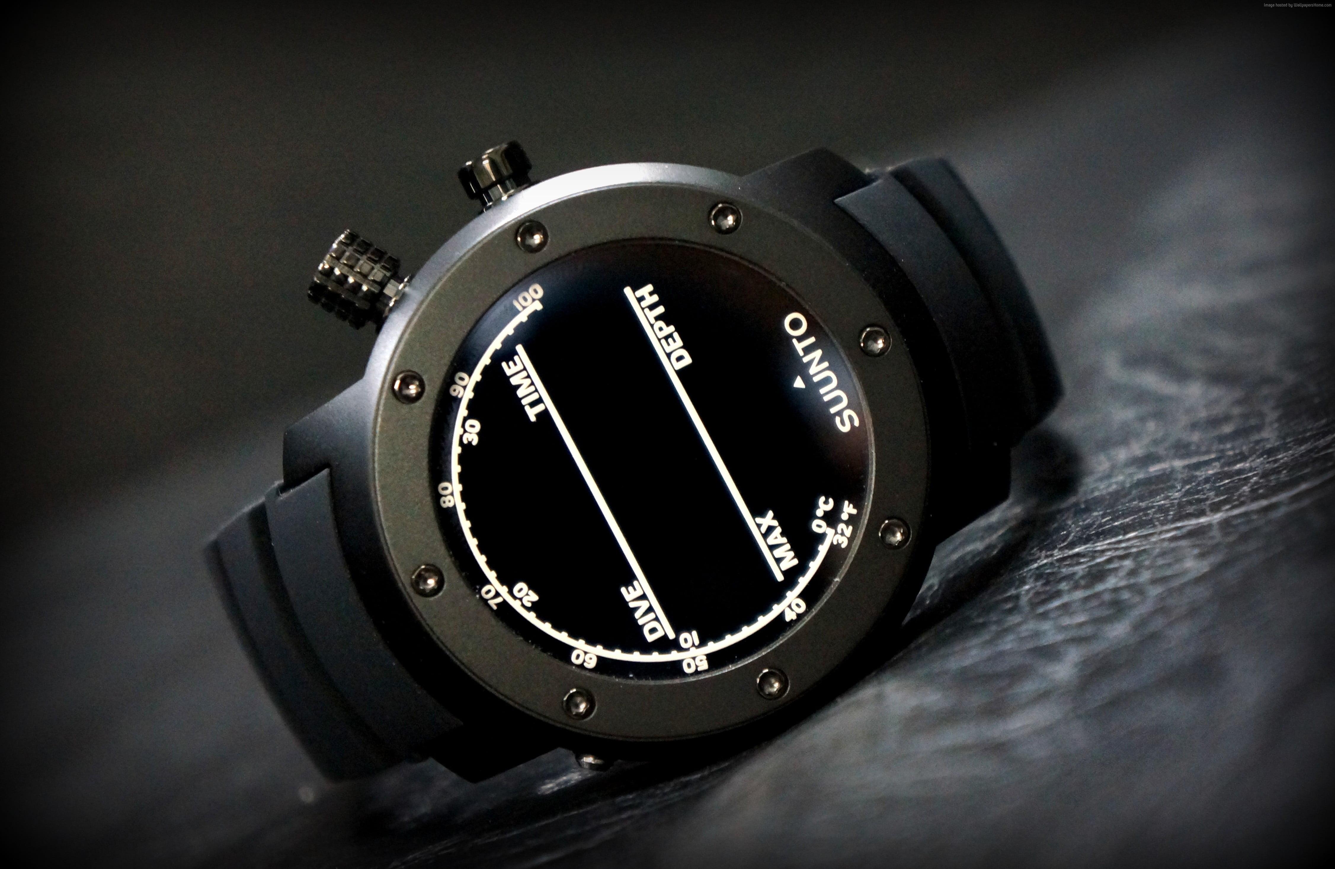 Round gray smart watch on black surface HD wallpaper