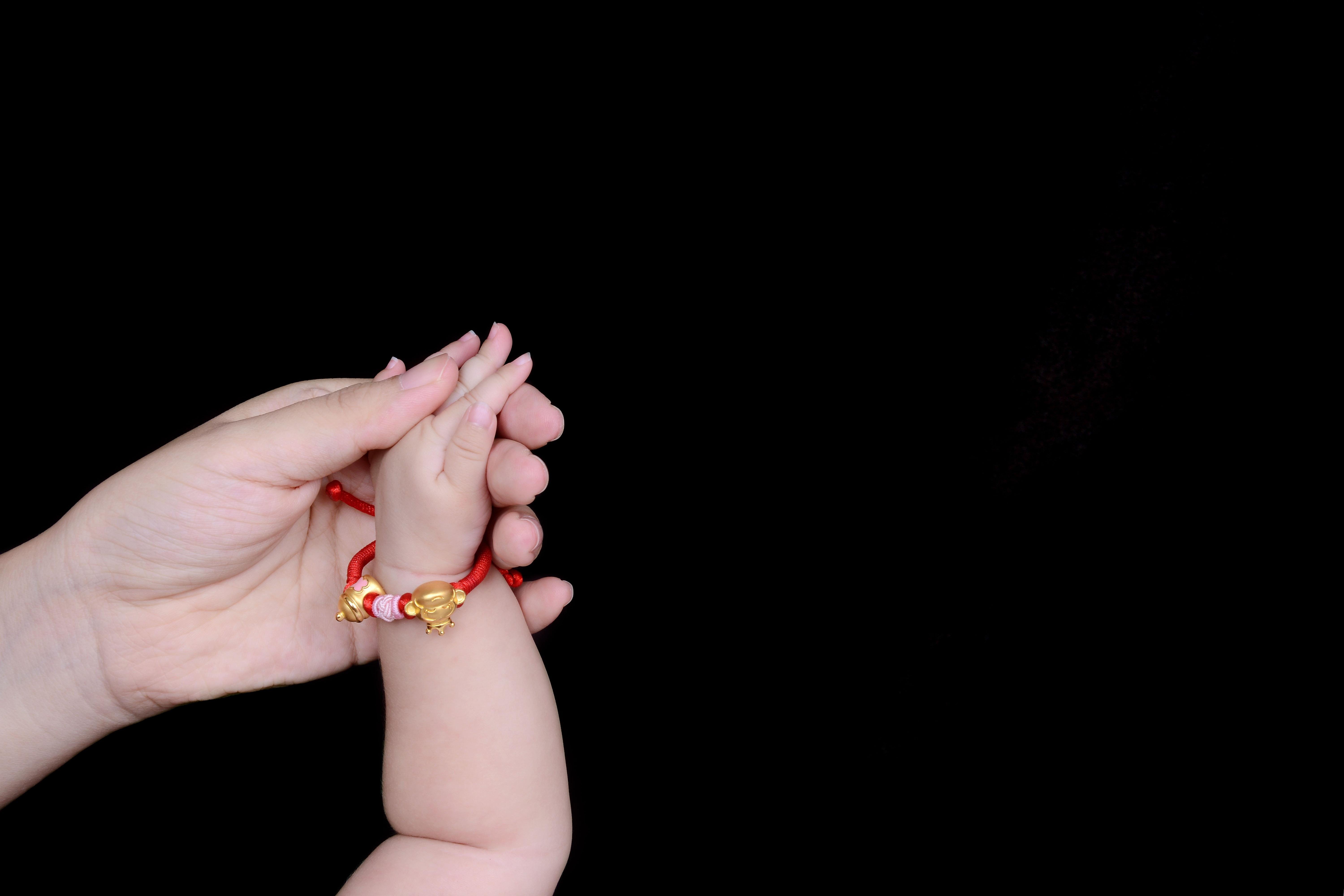 Person Holding Baby's Hand · Free