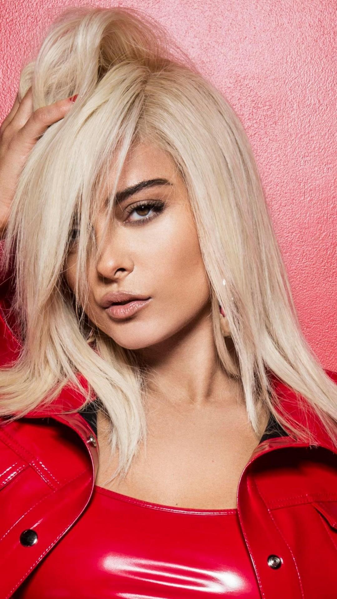 Download 1080x1920 Bebe Rexha, Musician, Blonde, Red Jacket