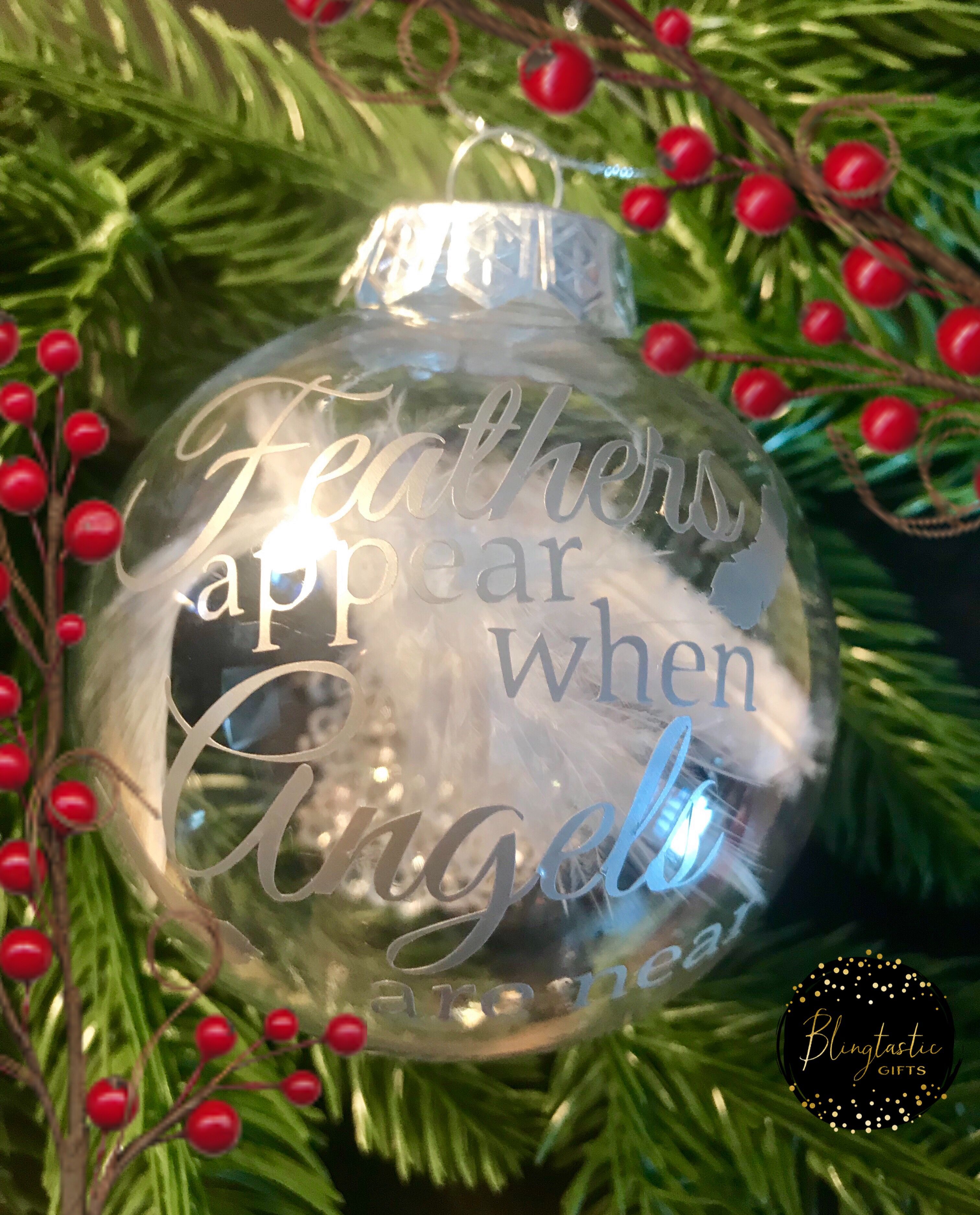 Large clear baubles filled with a pretty white feather