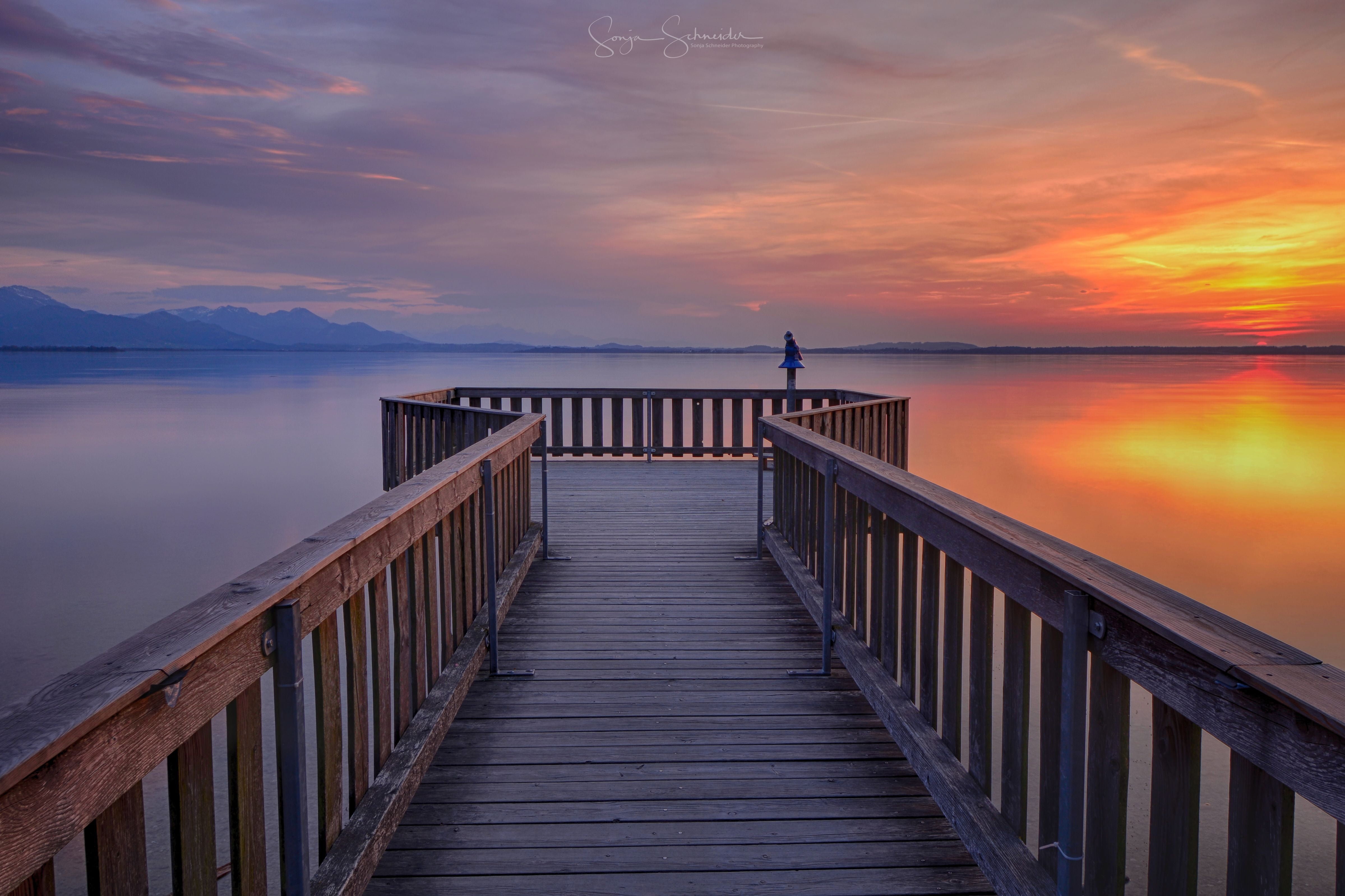 Landscape photography of brown wooden pier on lake under