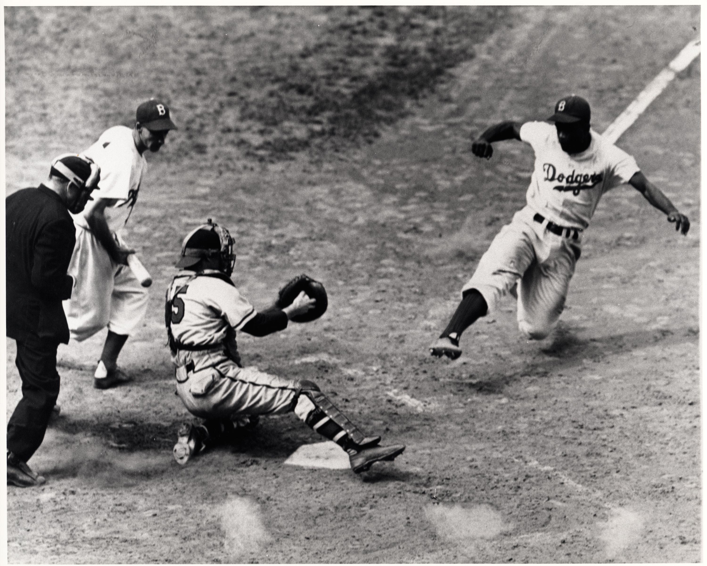 Jackie Robinson sliding into home against Yankees catcher