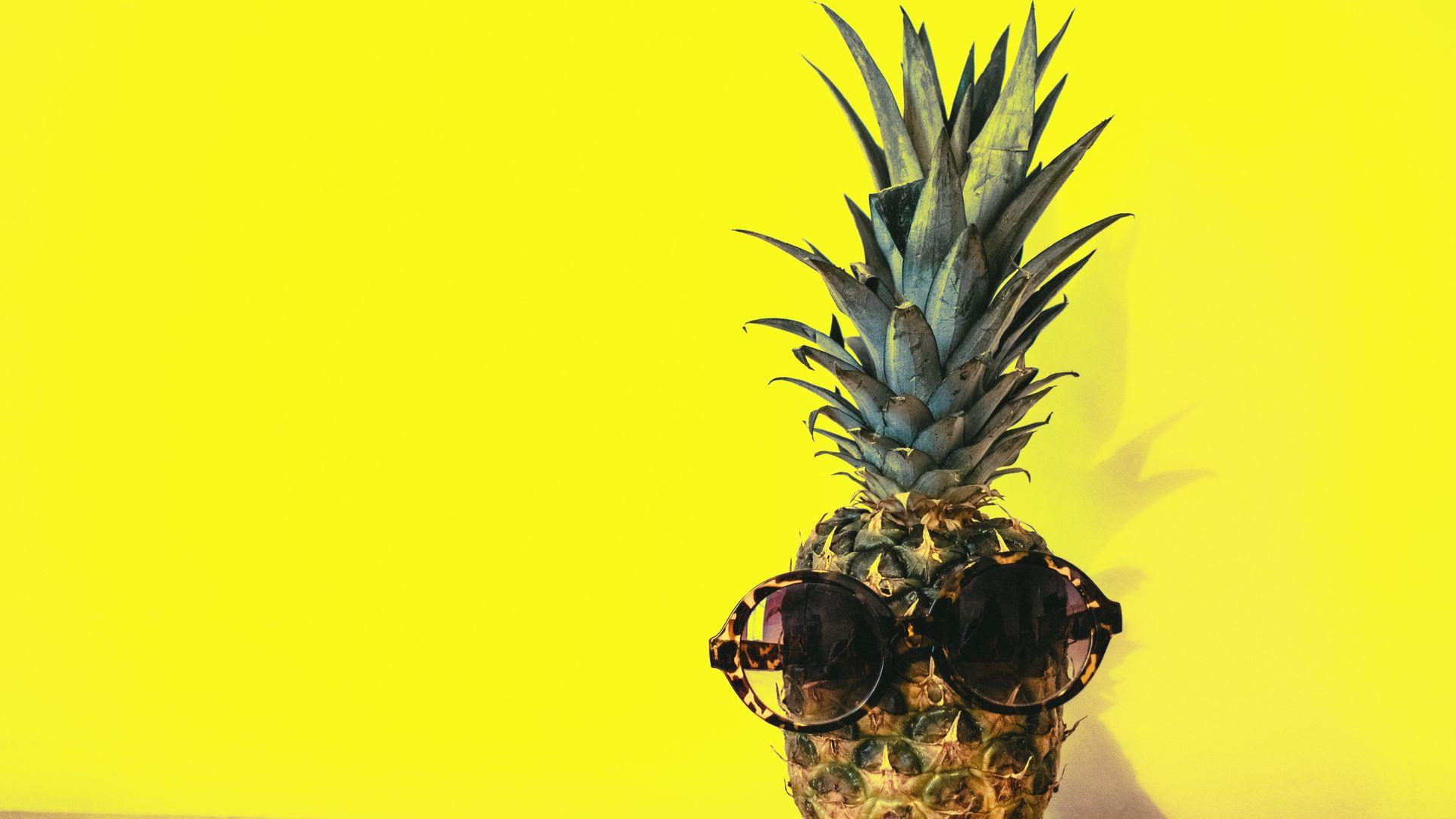 Pineapple with Sunglasses beside Yellow Surface Wallpaper