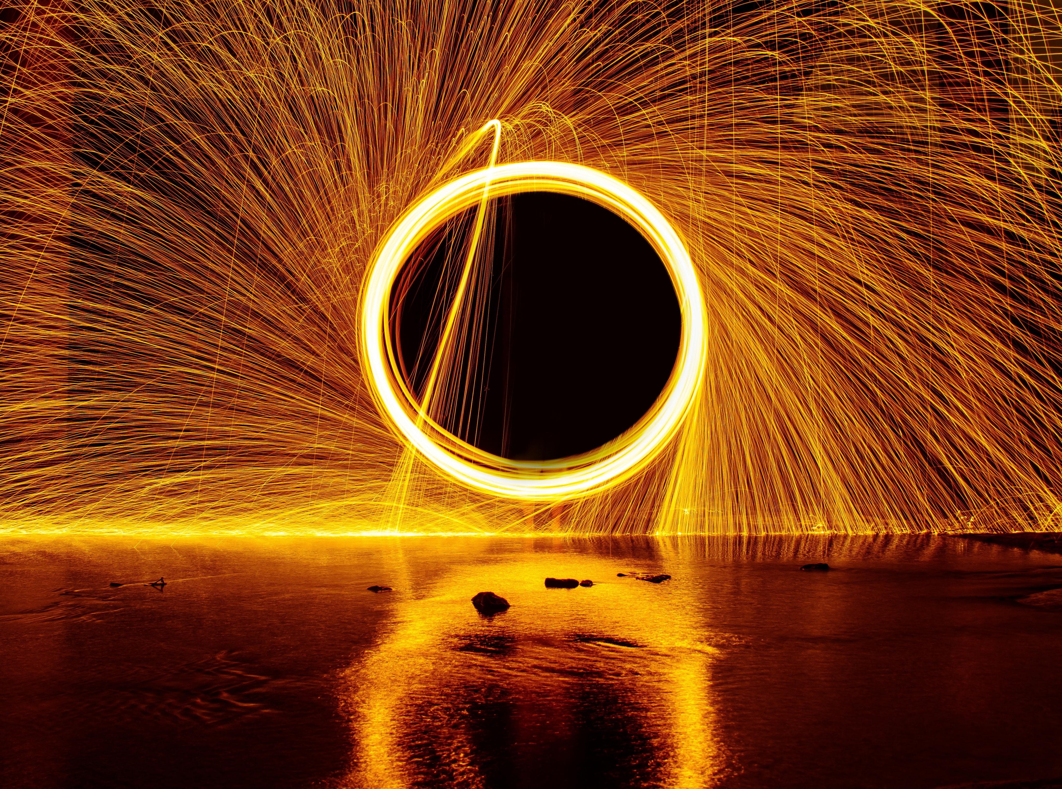 HD wallpaper: person taking photo of round steel wool, spark