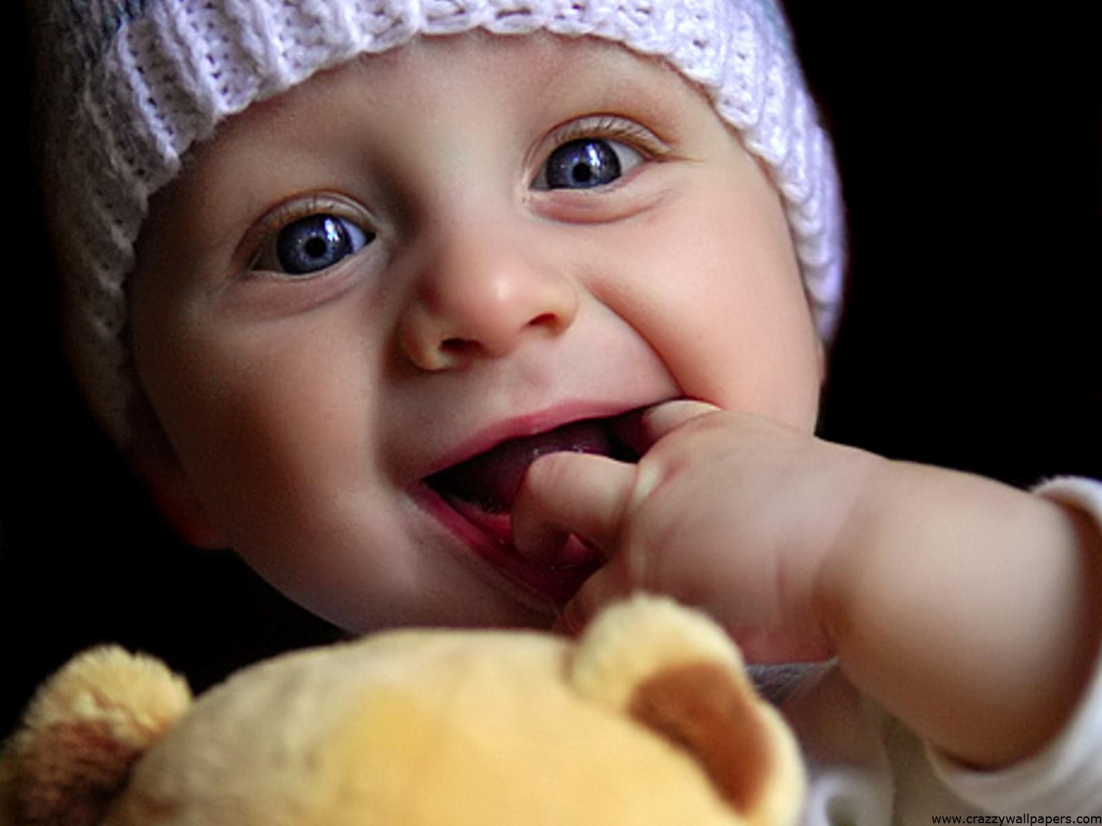 Cute Baby Child Playing with Doll Wallpaper