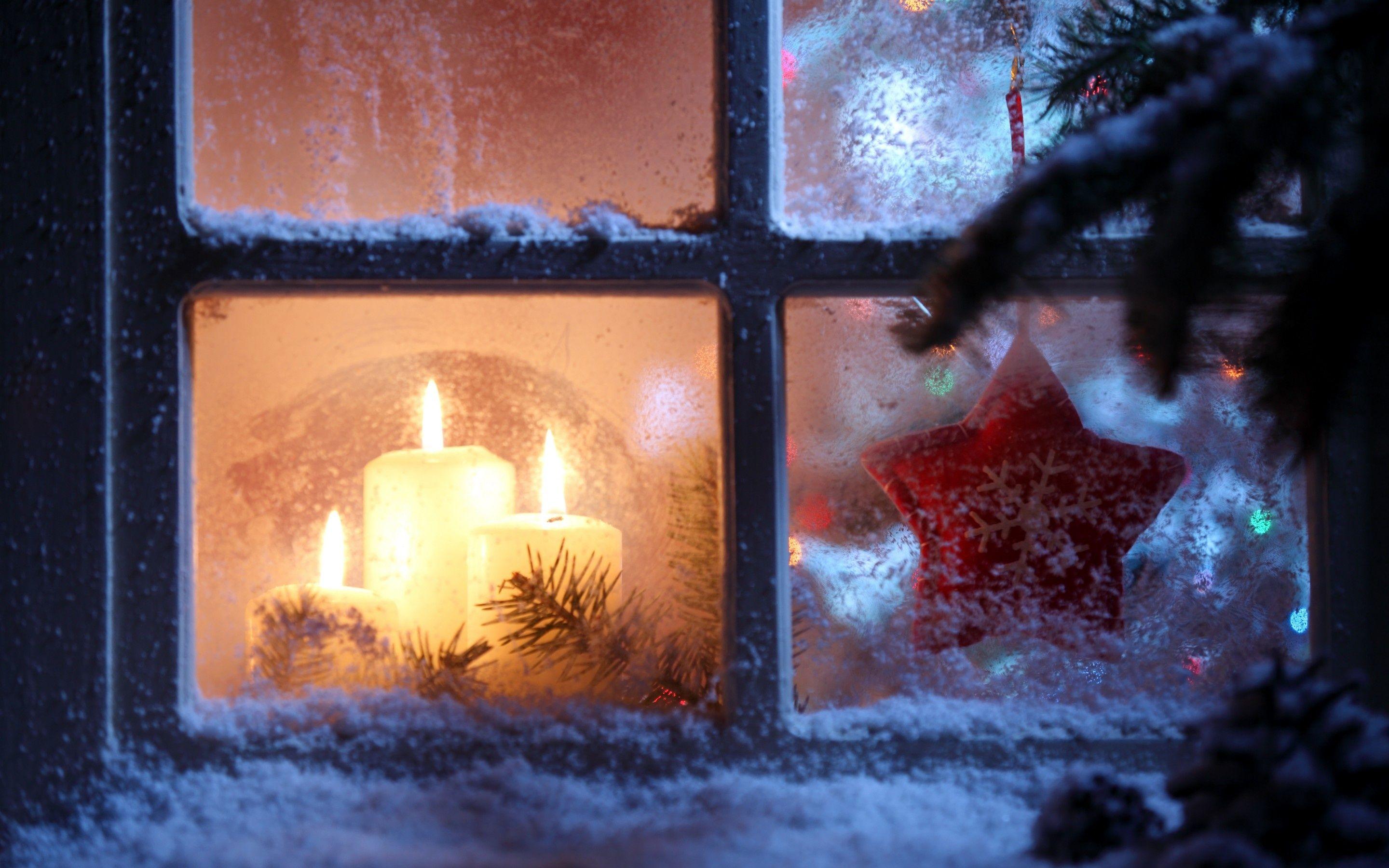 candles in frosty window. Christmas candles, Christmas