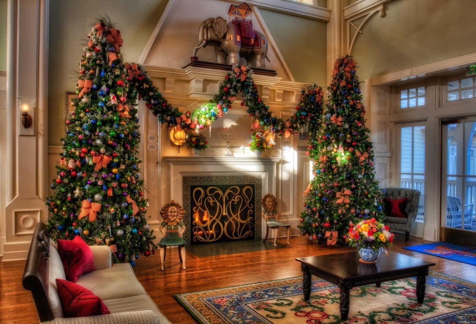 Two giant green christmas tree beside fireplace HD wallpaper