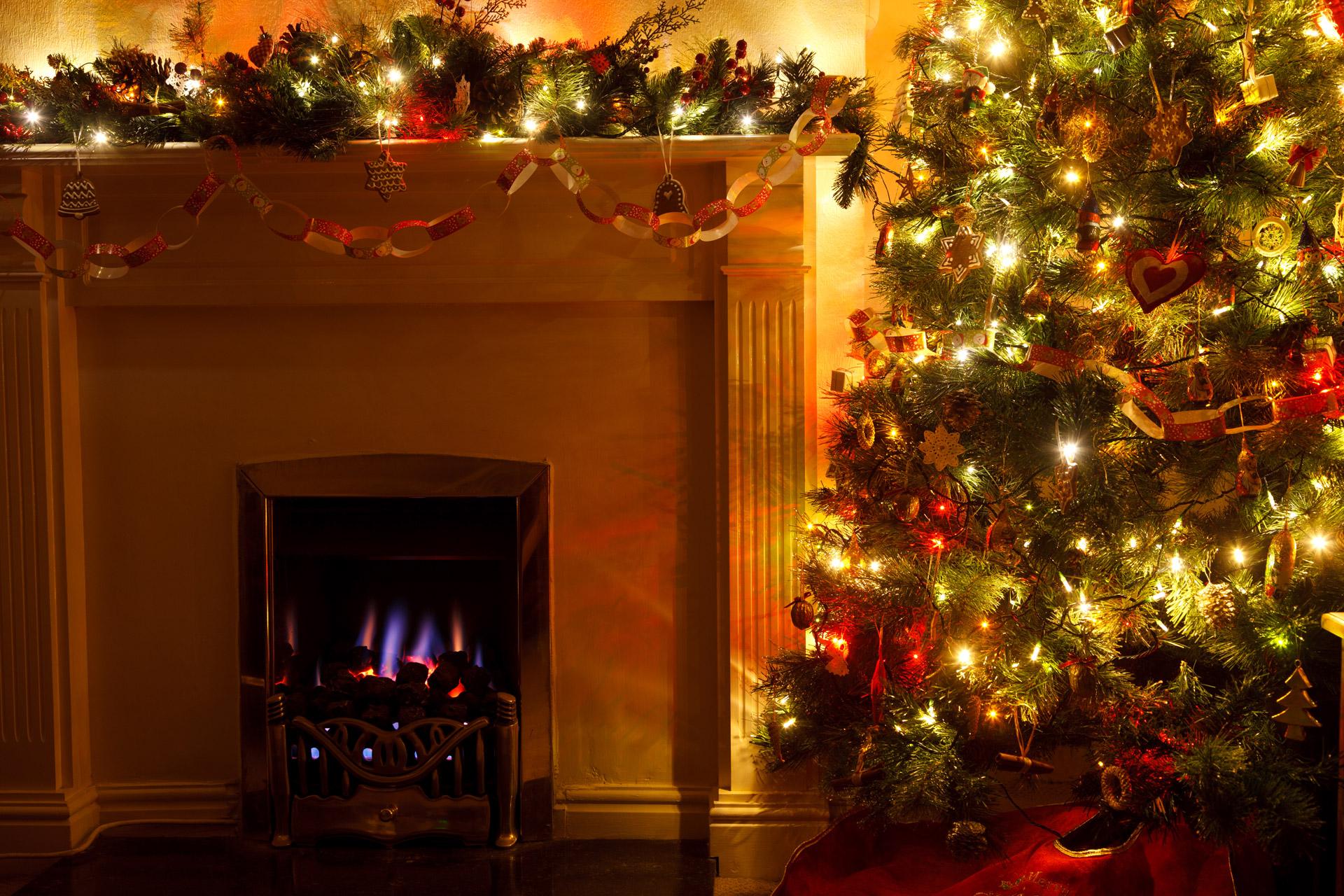 Decorations On A Christmas Tree Near A Fireplace HD