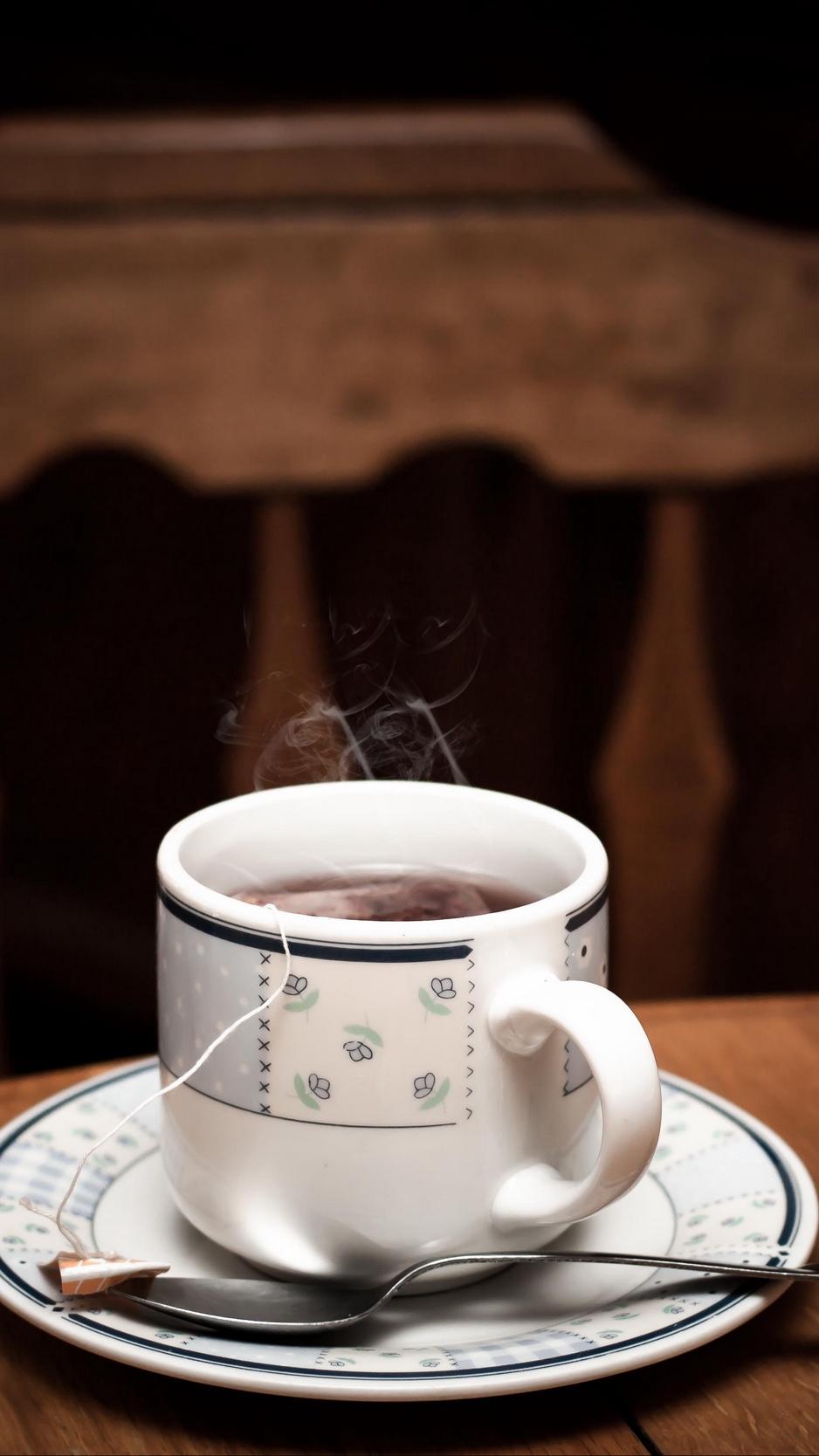 Download wallpaper 938x1668 cup, tea, table, drink, vapor