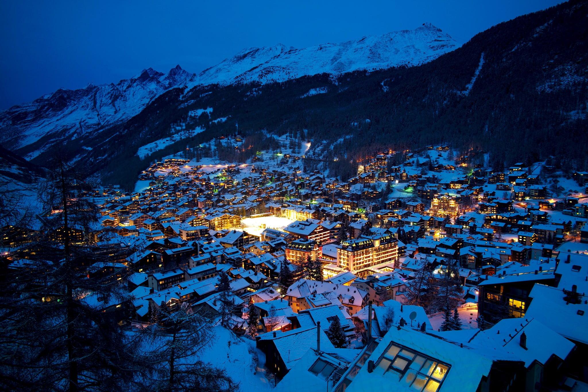 Aerial photography of village covered of snow, mountains