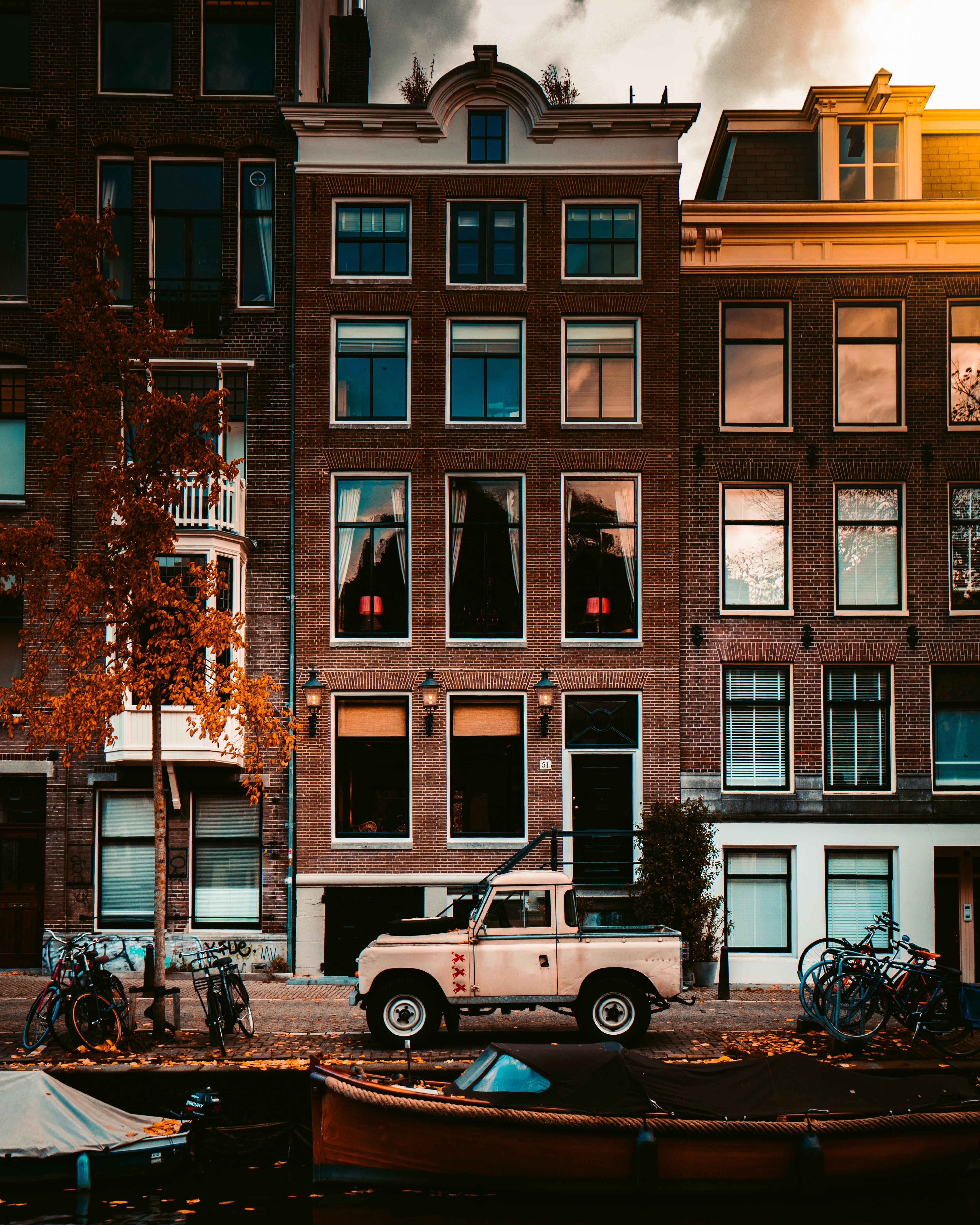 Download wallpaper 3987x4984 building, facade, car, pickup