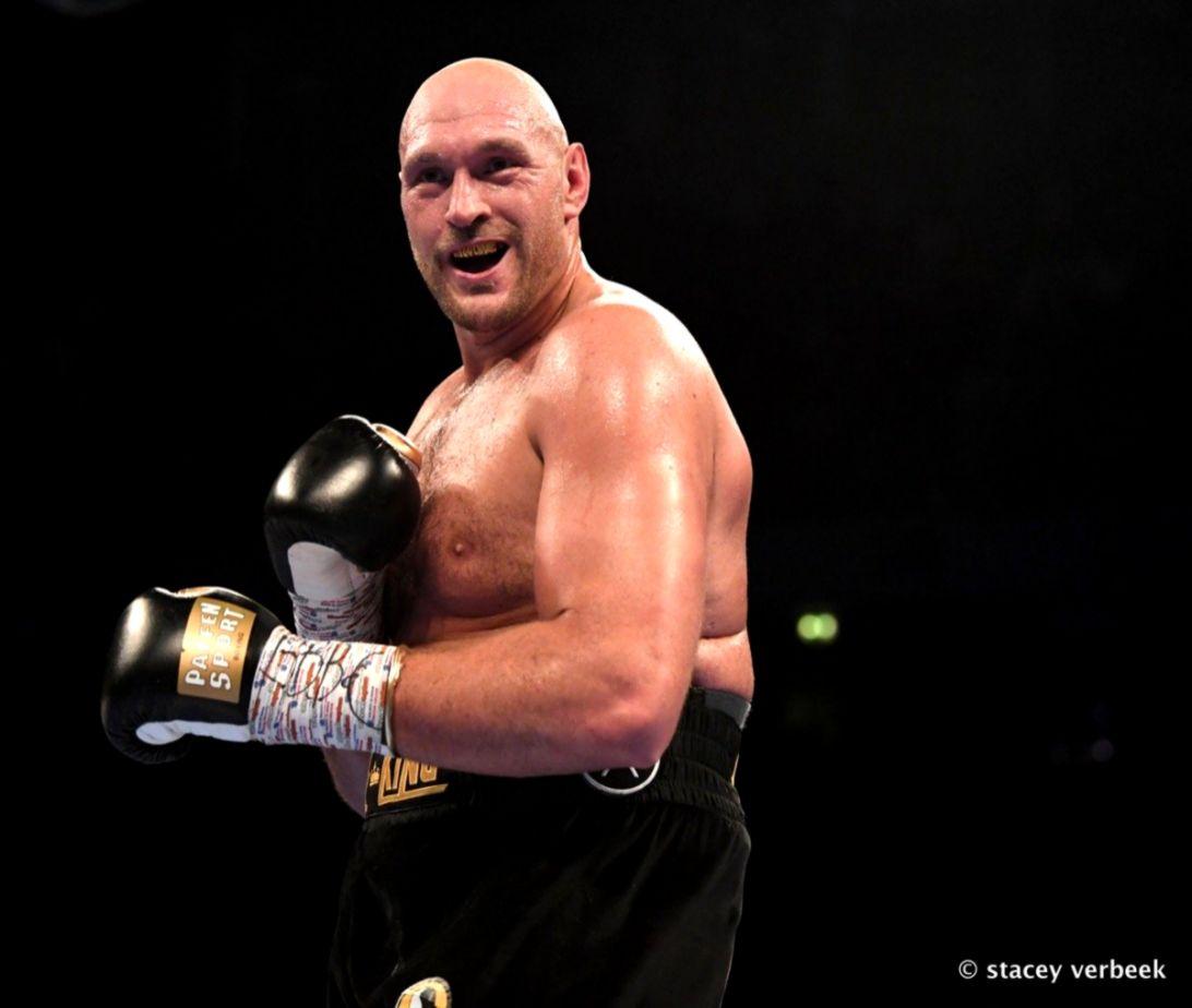 Download Tyson Fury Screaming With Boxing Belts Wallpaper  Wallpaperscom